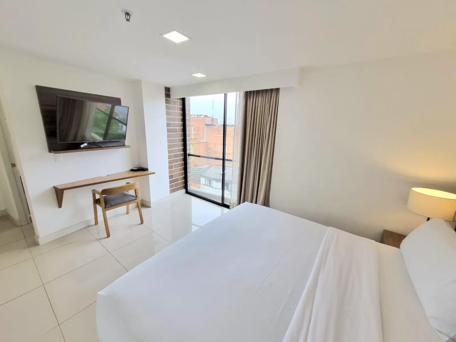 Bed in Origen Local Suites