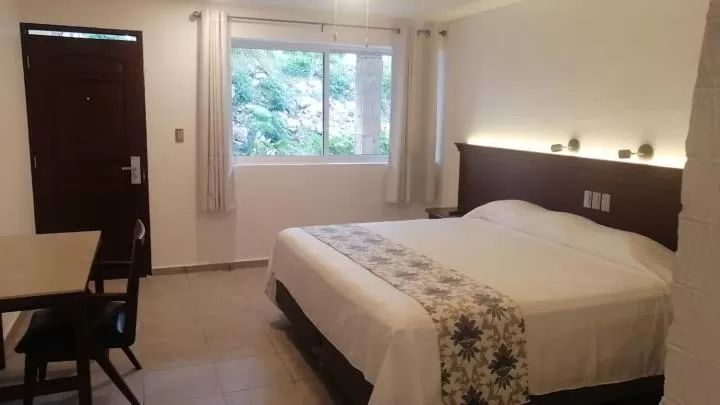 Photo of the whole room, Bed in Hotel Puerta Chichen