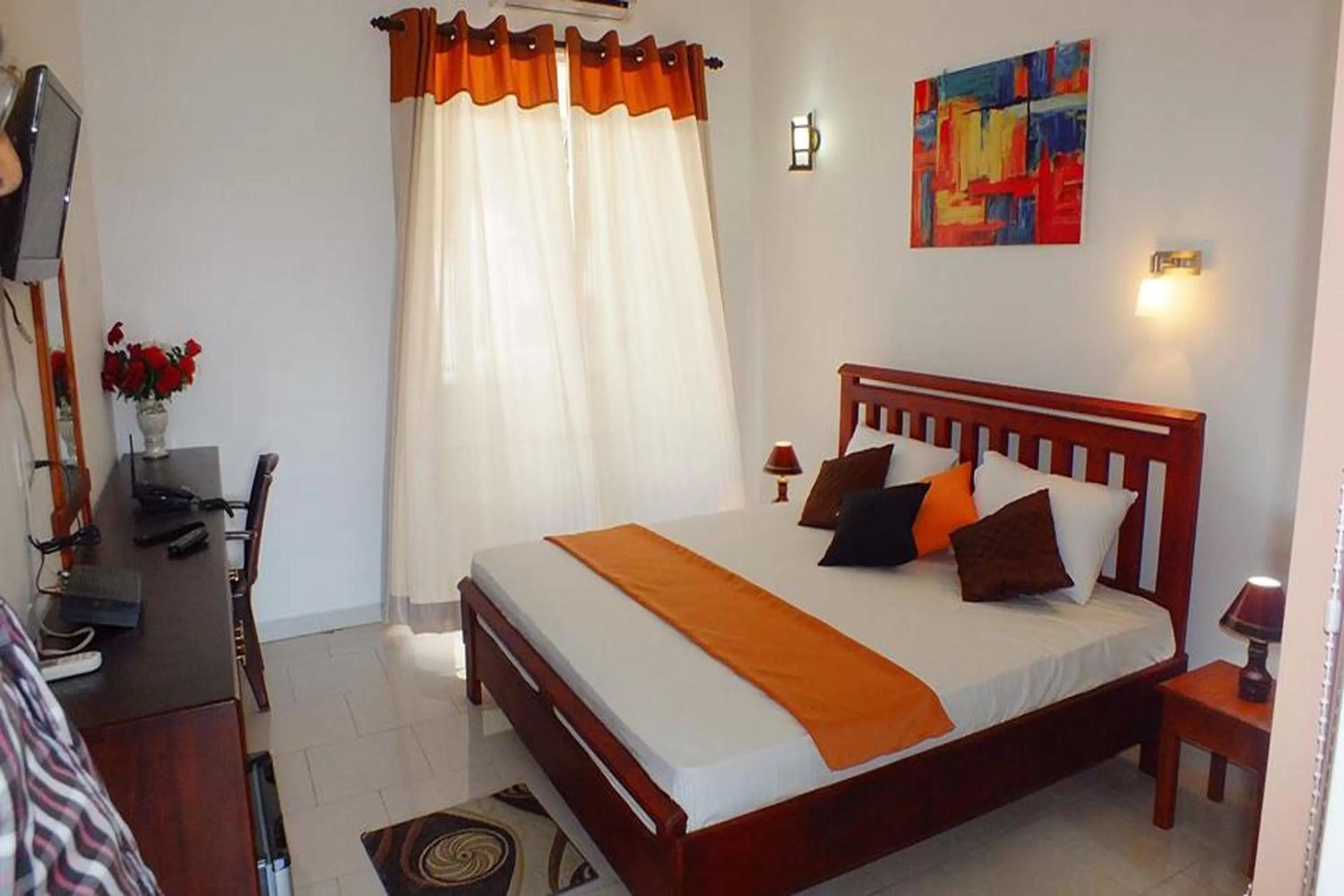 Bed in WindMill Beach Villa and Hotel