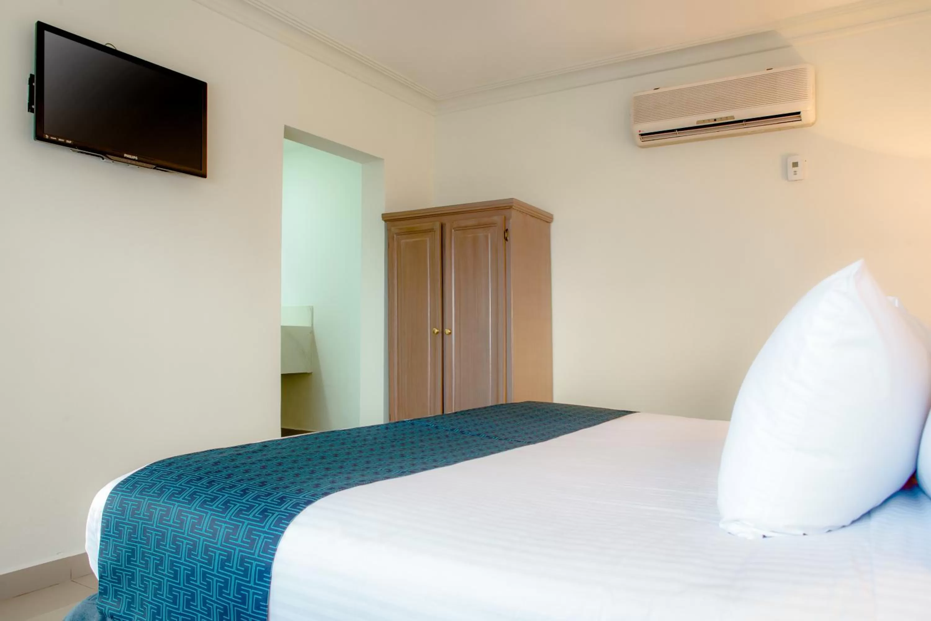 Bed in InHouse Hotel Culiacán