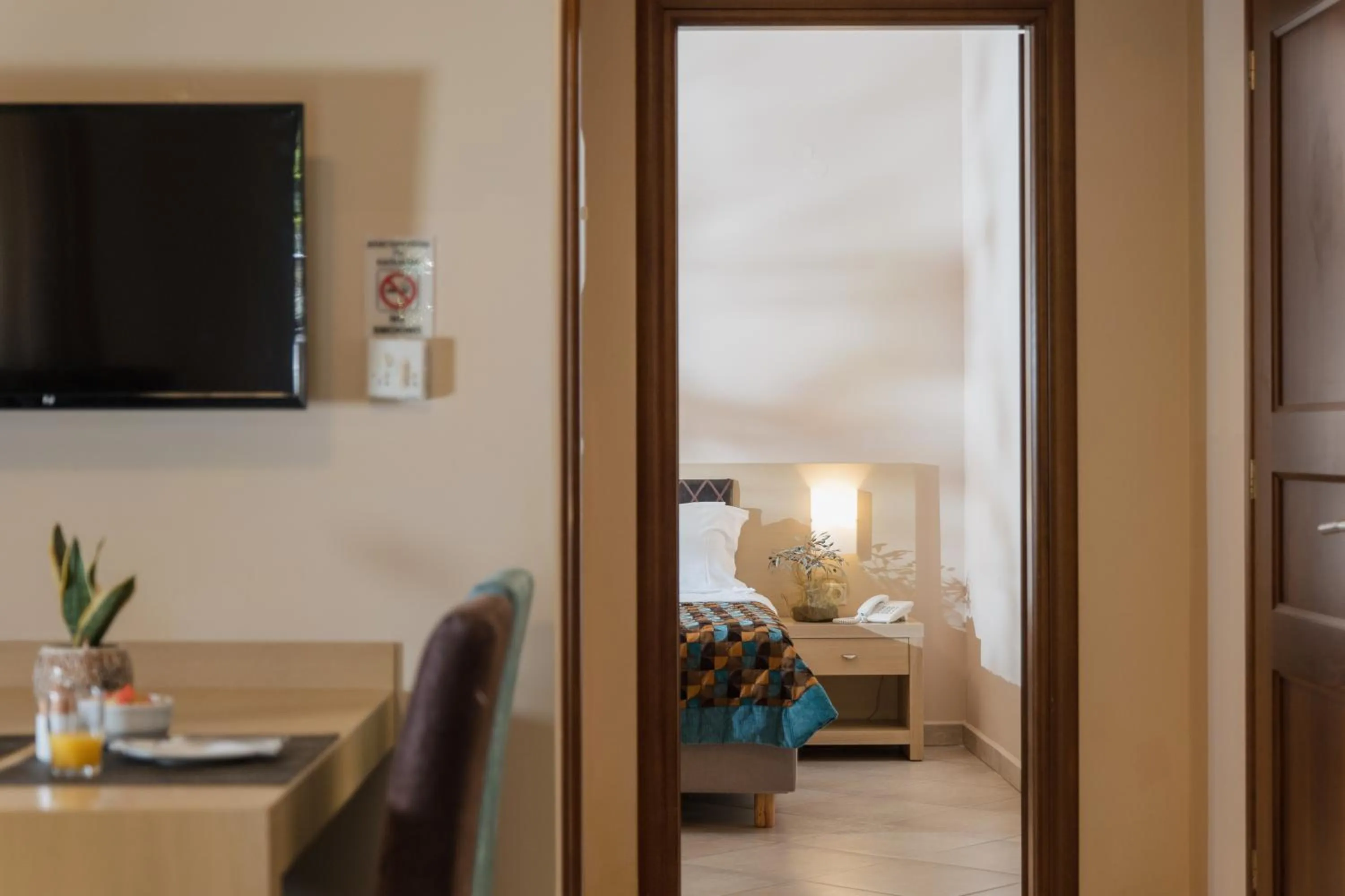 Living room, Bed in Molos Bay Hotel