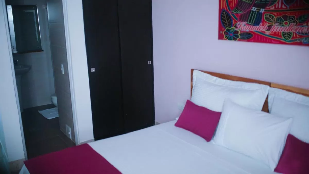 Bed in Kamaleb Farallones Hotel