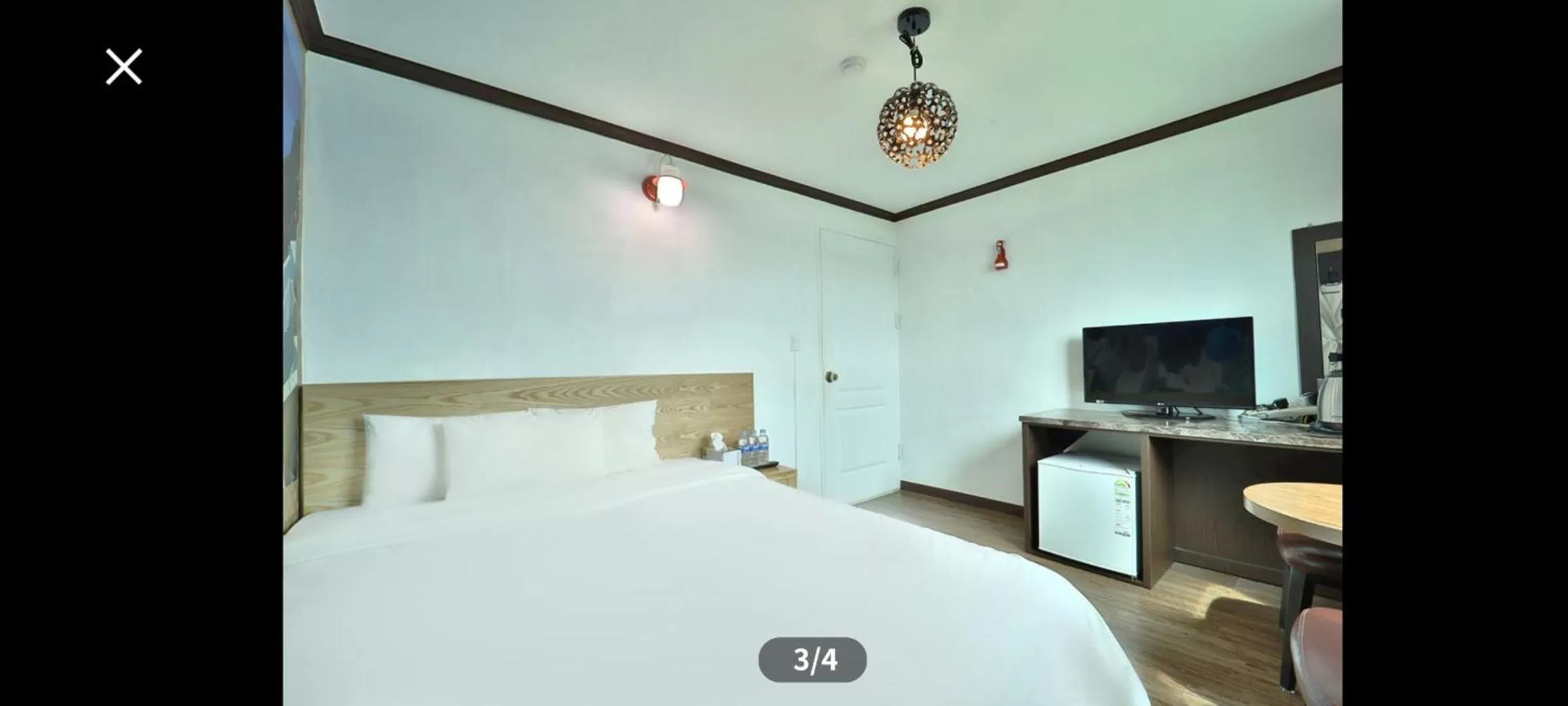 Bed in Saipan Motel with Sea View