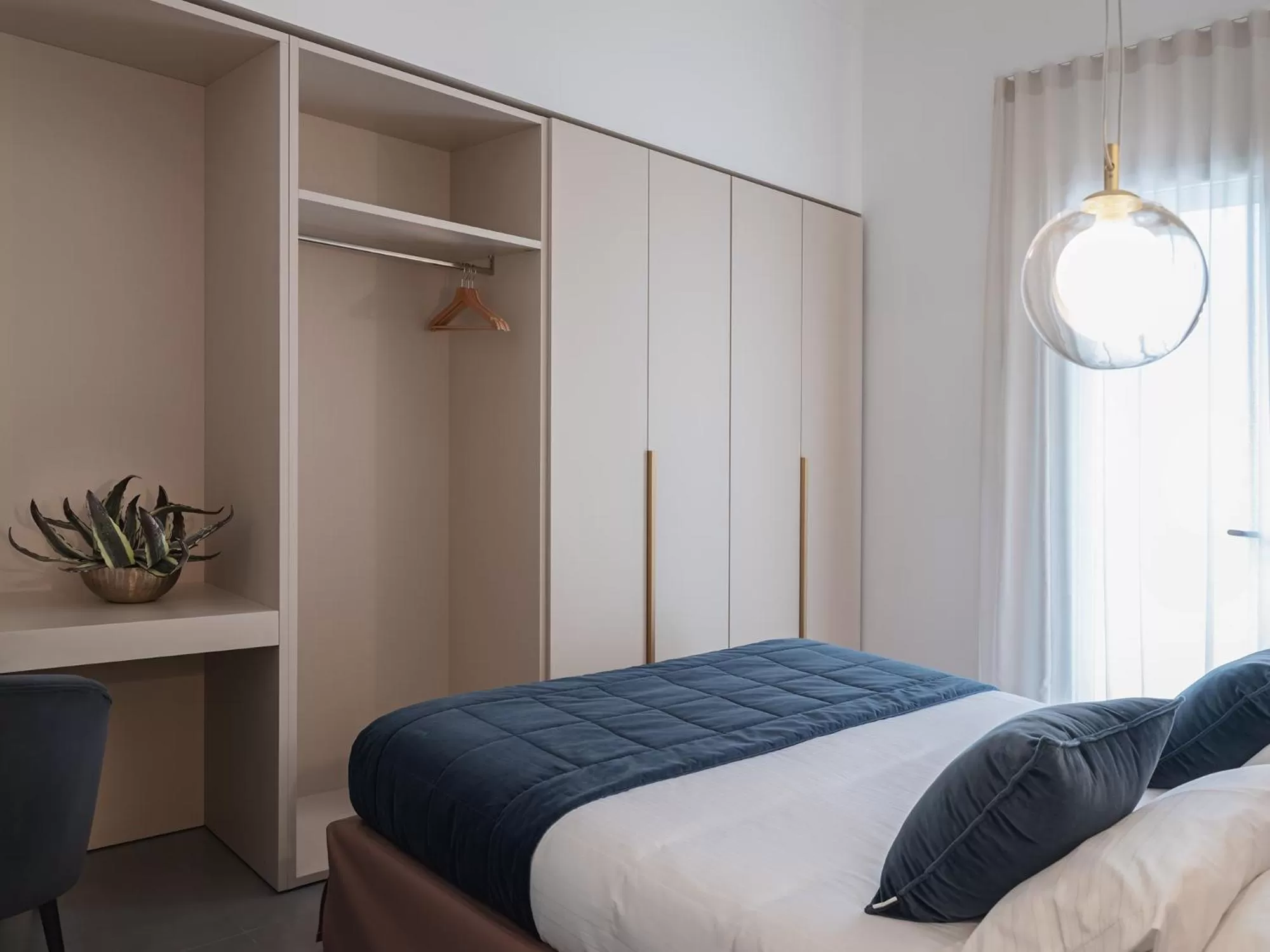 Photo of the whole room, Bed in Living u HomeSuites