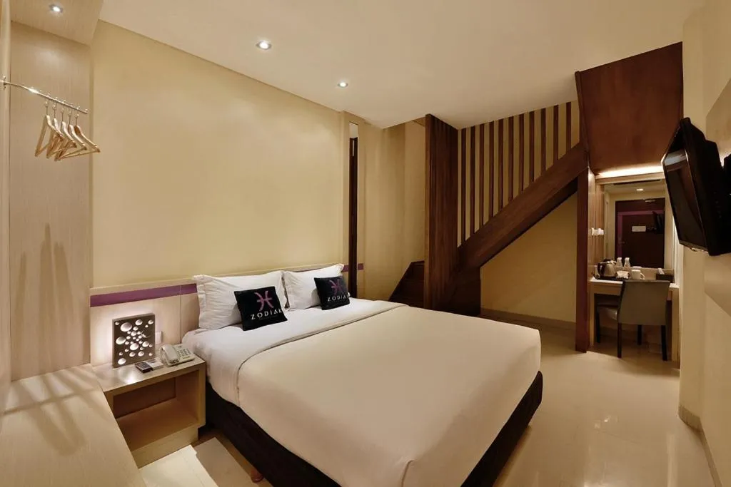Bed in Zodiak Kebon Kawung by KAGUM Hotels