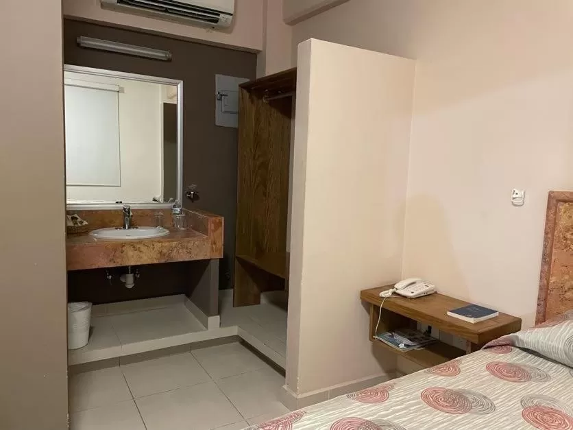 Bed in Hotel Santo Domingo Express