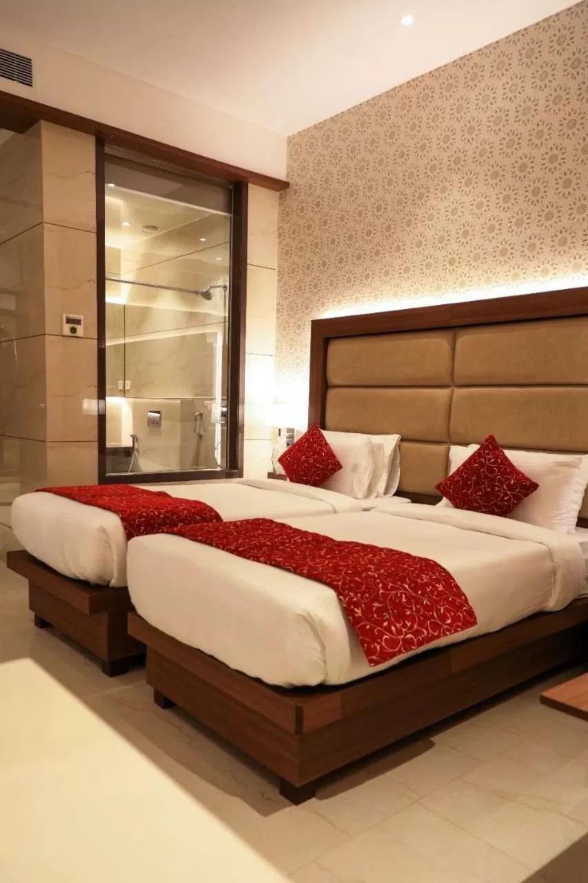 Bed in Hotel Gurudev Grand