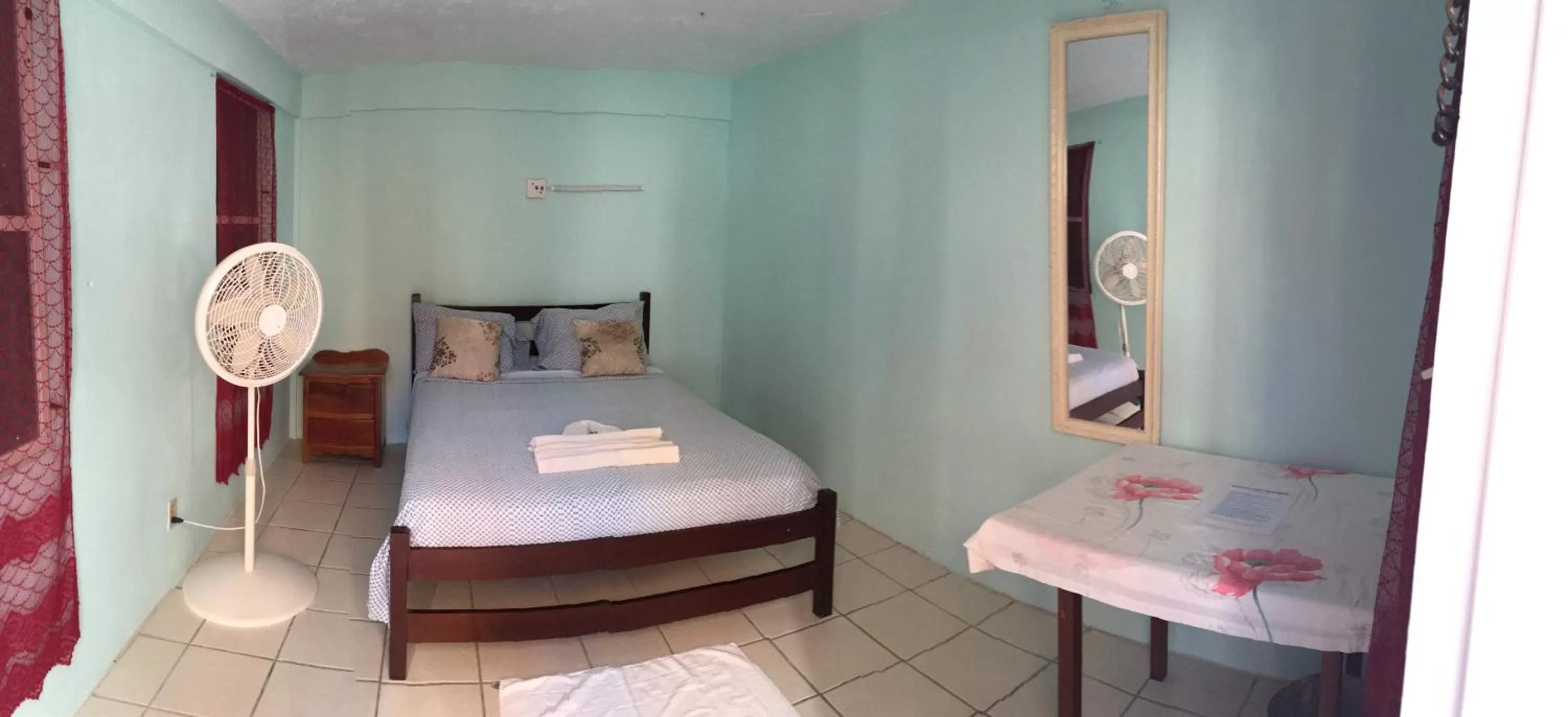 Bed in Blue Wave Guest House