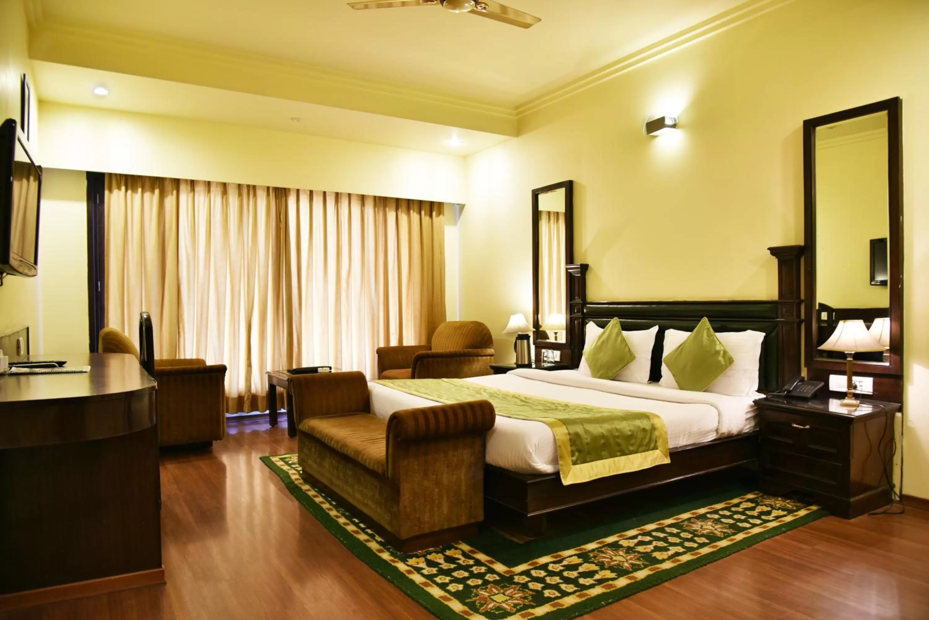 Photo of the whole room, Bed in Indraprastha Resort - Centrally Heated Rooms, with Gym, Games & Spa