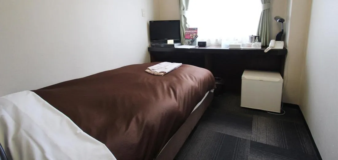 Bed in Takamatsu City Hotel