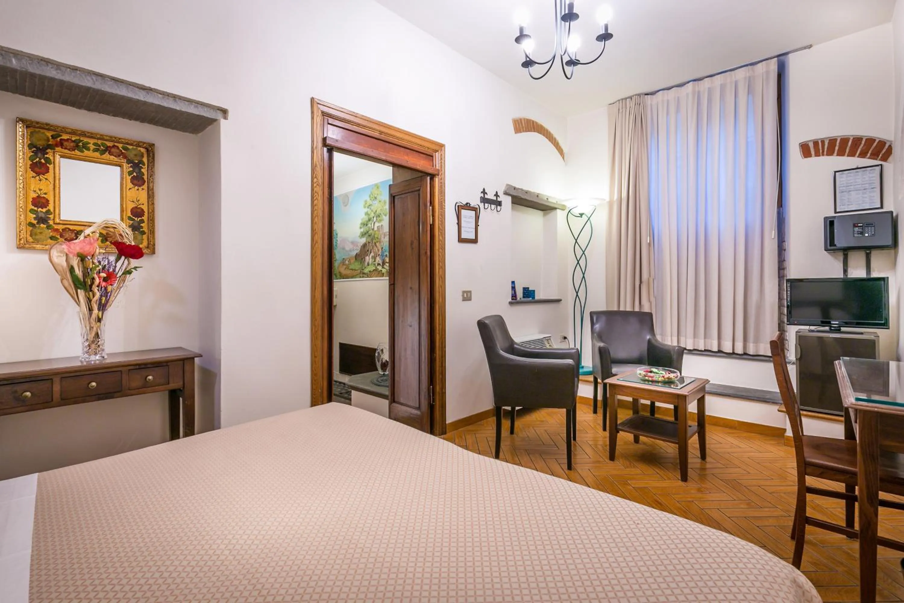 Seating area, Bed in Hotel Collodi Firenze