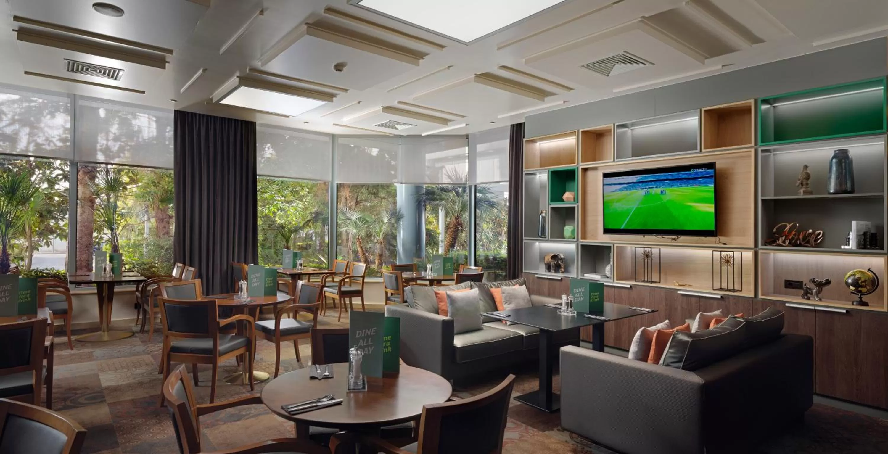 Lounge or bar in Holiday Inn Athens Attica Av, Airport W. by IHG
