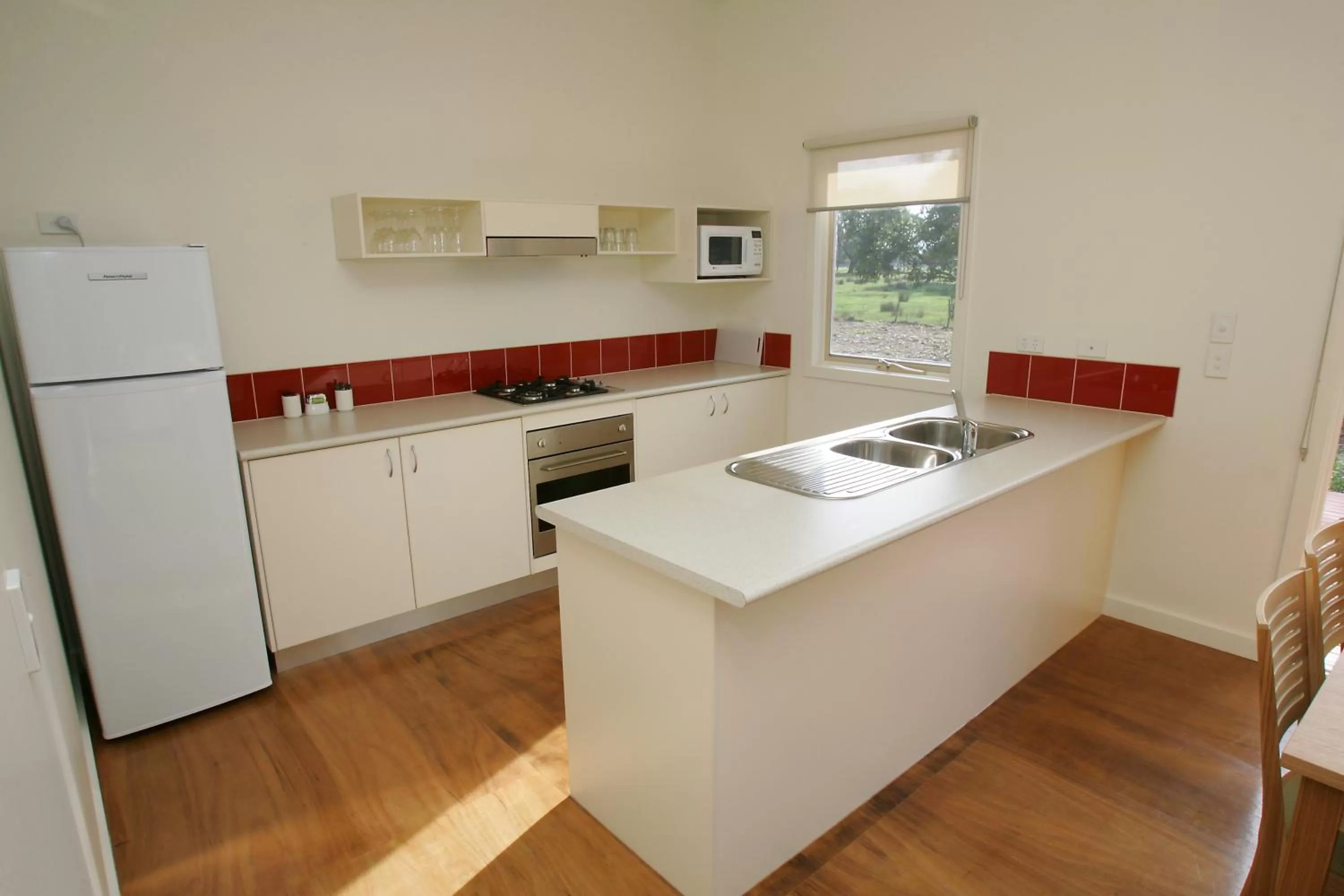 Kitchen or kitchenette in Ramada Resort by Wyndham Phillip Island