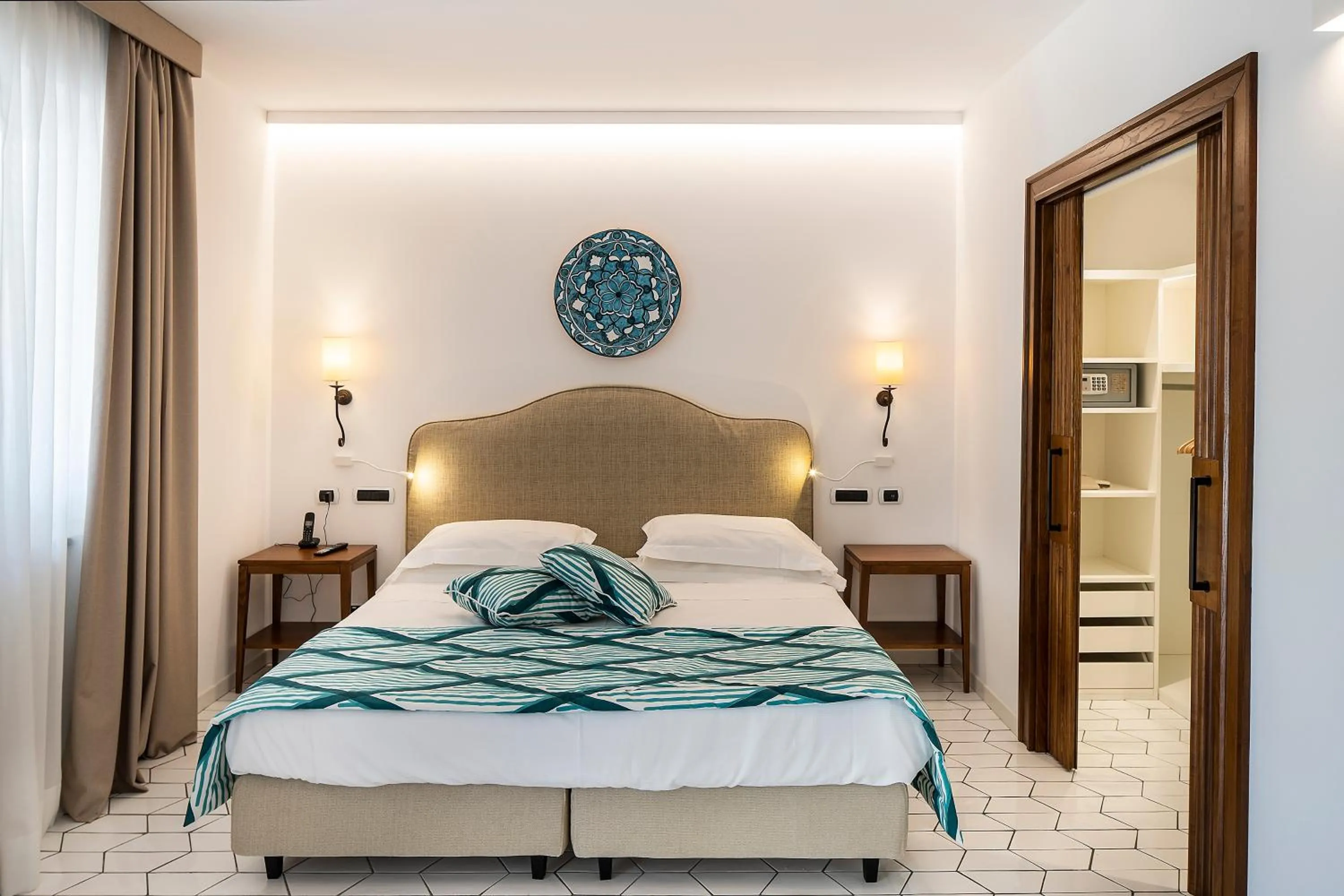 Bed in Therasia Resort Sea and SPA - The Leading Hotels of the World