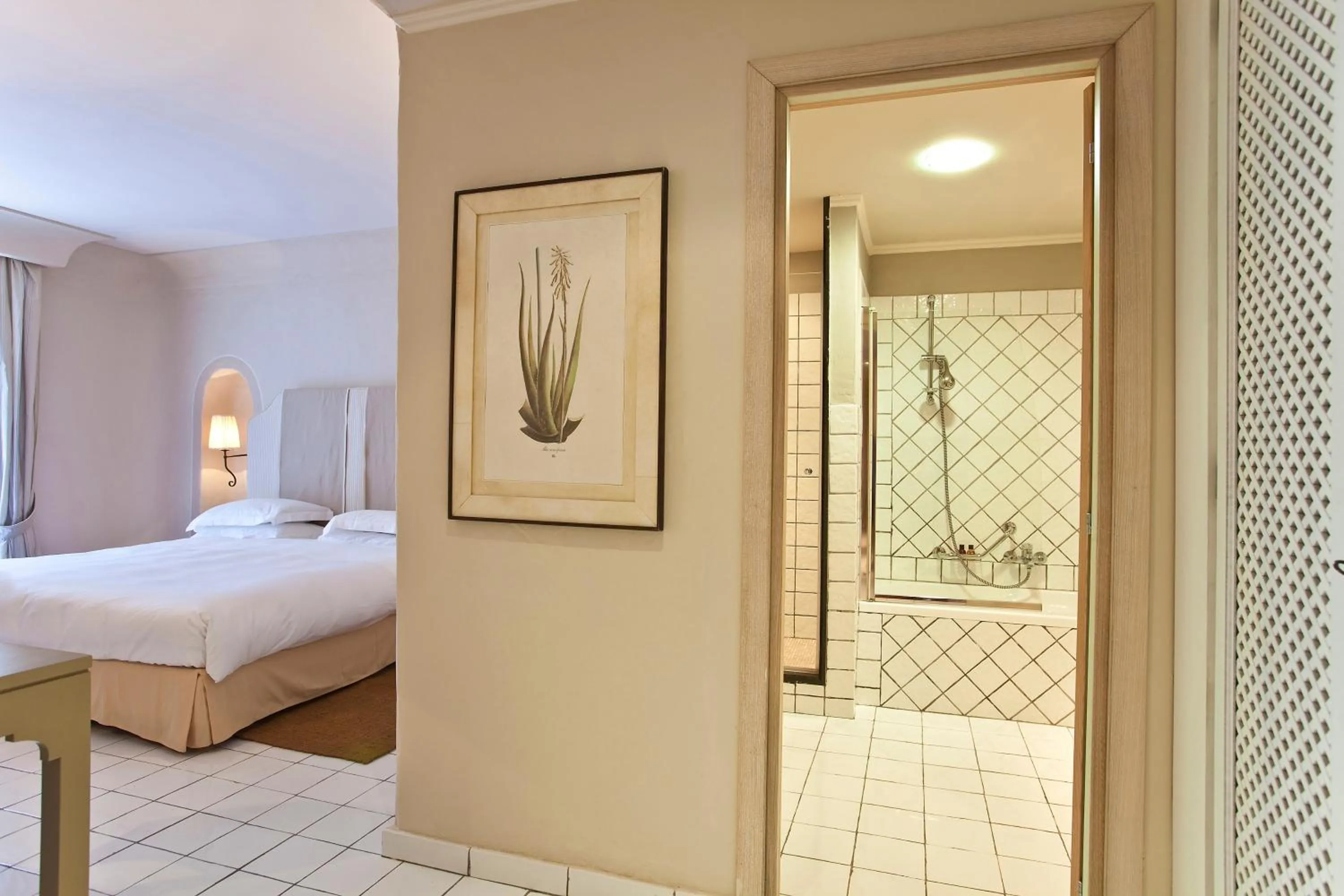 Bed in Therasia Resort Sea and SPA - The Leading Hotels of the World