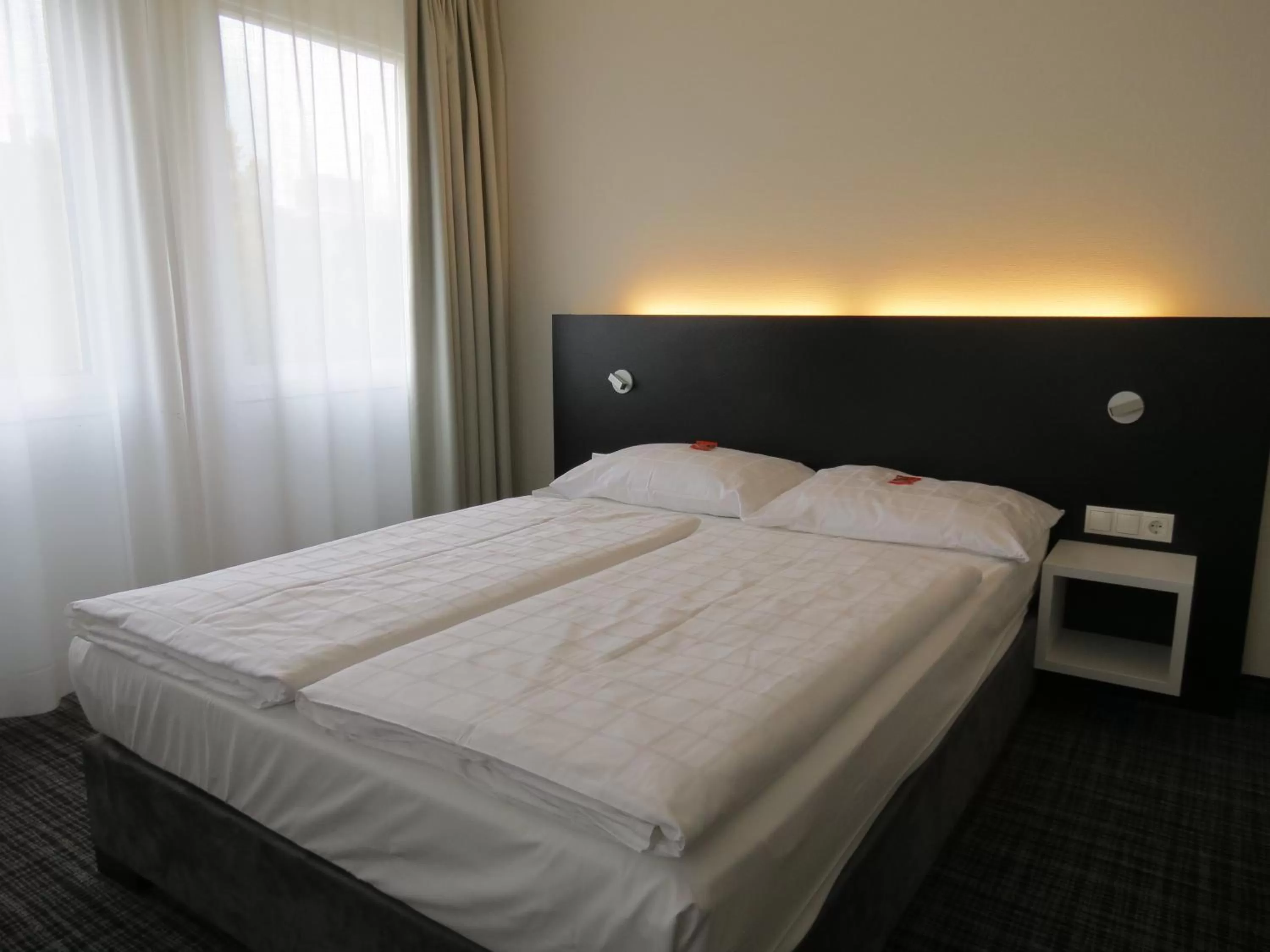 Bed in Comfor Hotel Ulm City