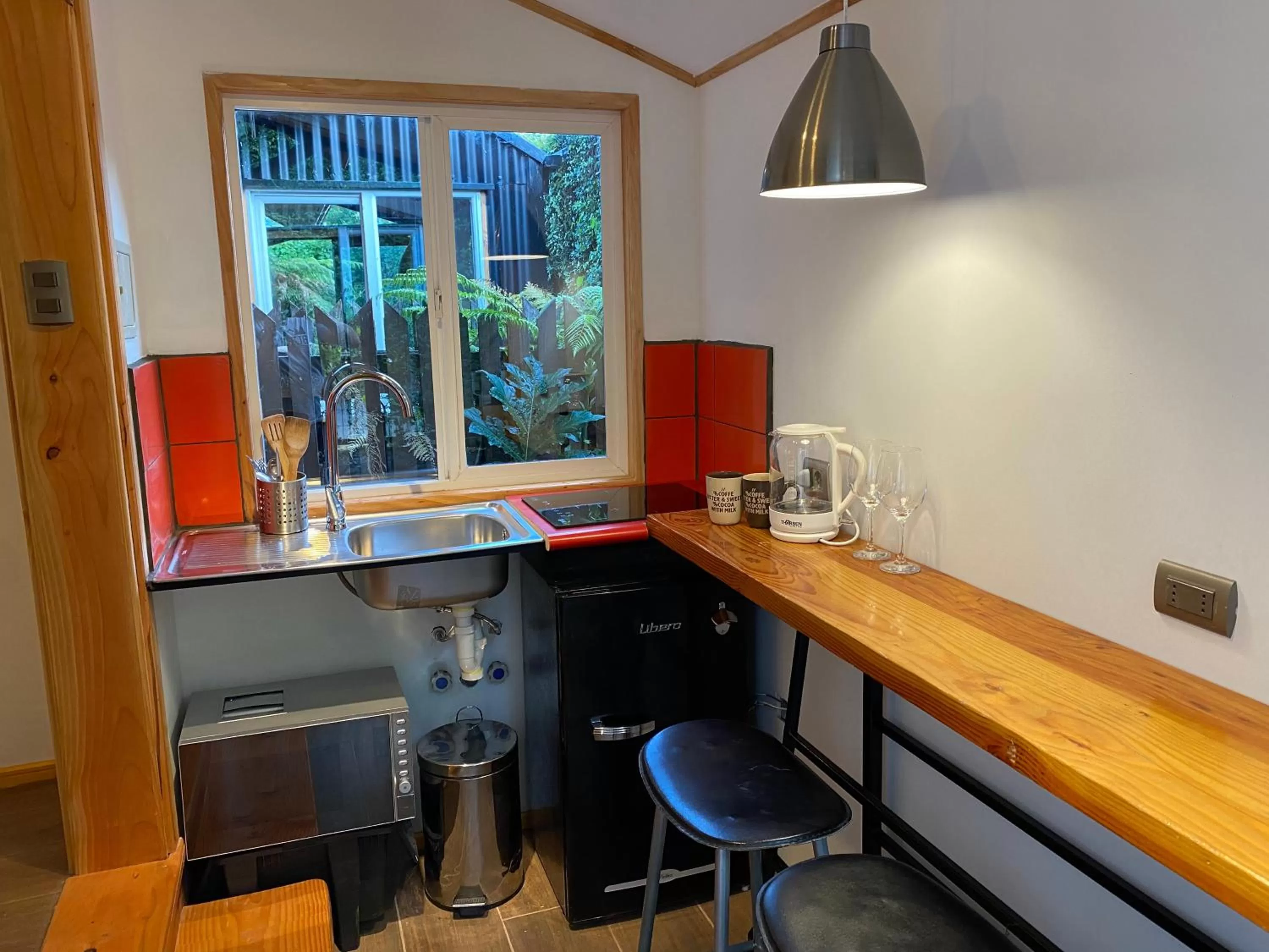 Kitchen or kitchenette in French Andes Apart Hostel