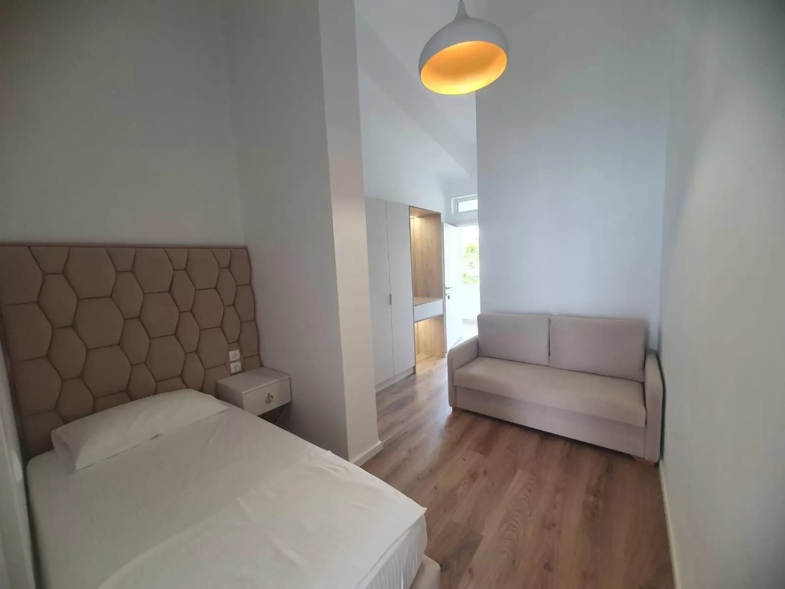 Bed in Murati Suites Sarandë