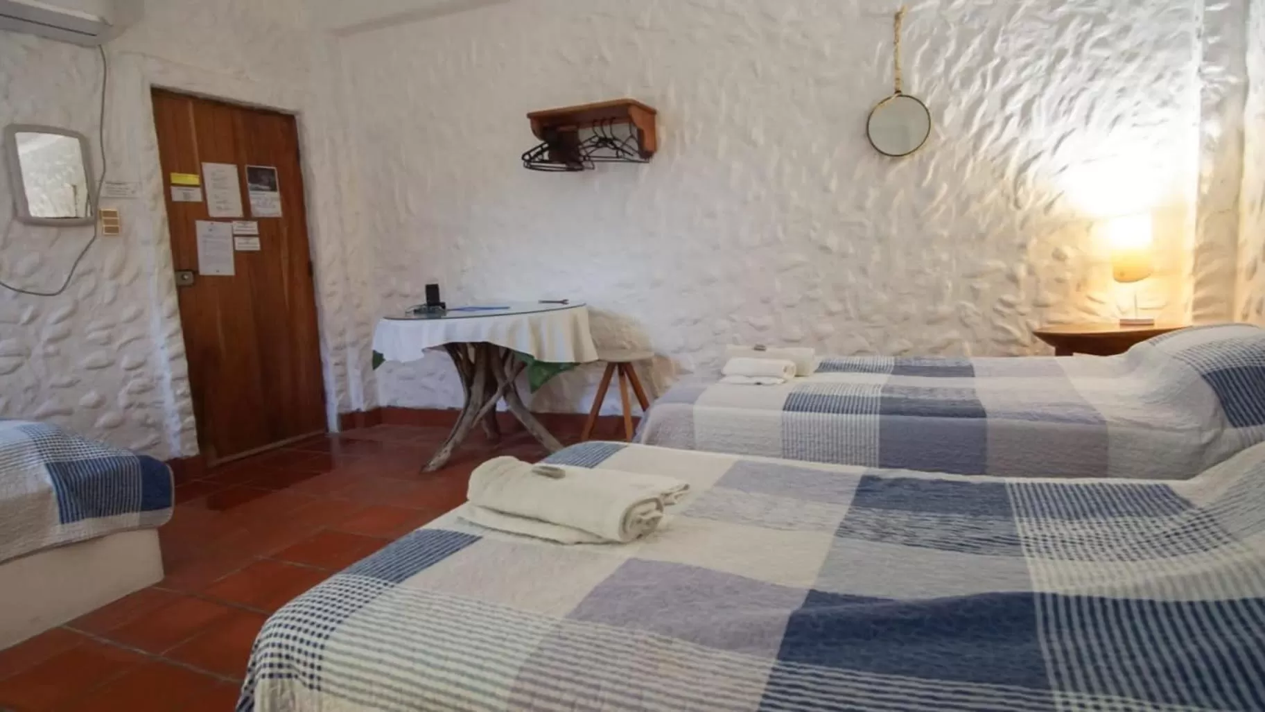 Bed in Hostal Galapagos by Bar de Beto