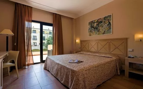 Bed in Mahara Hotel & Wellness