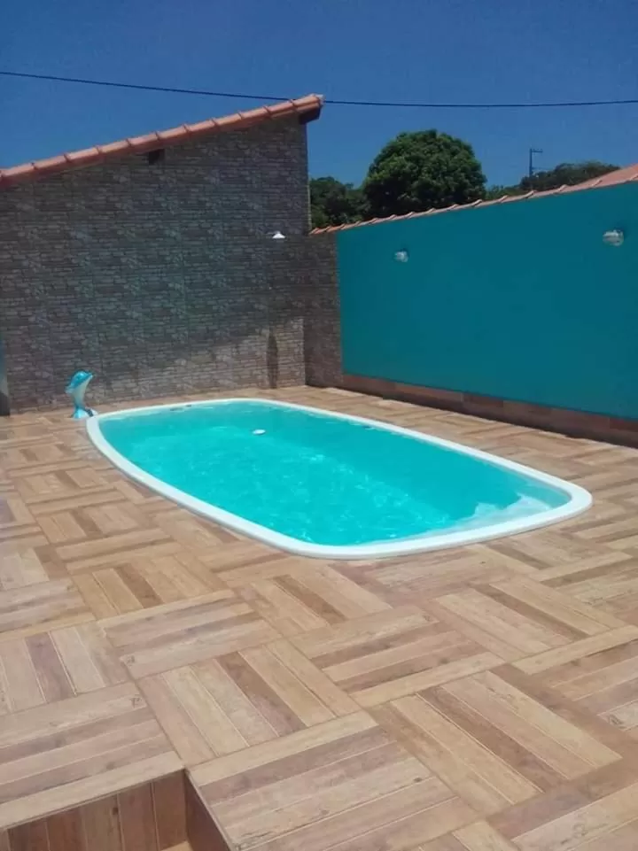 Swimming pool in Suítes Baía do Sol Saquarema