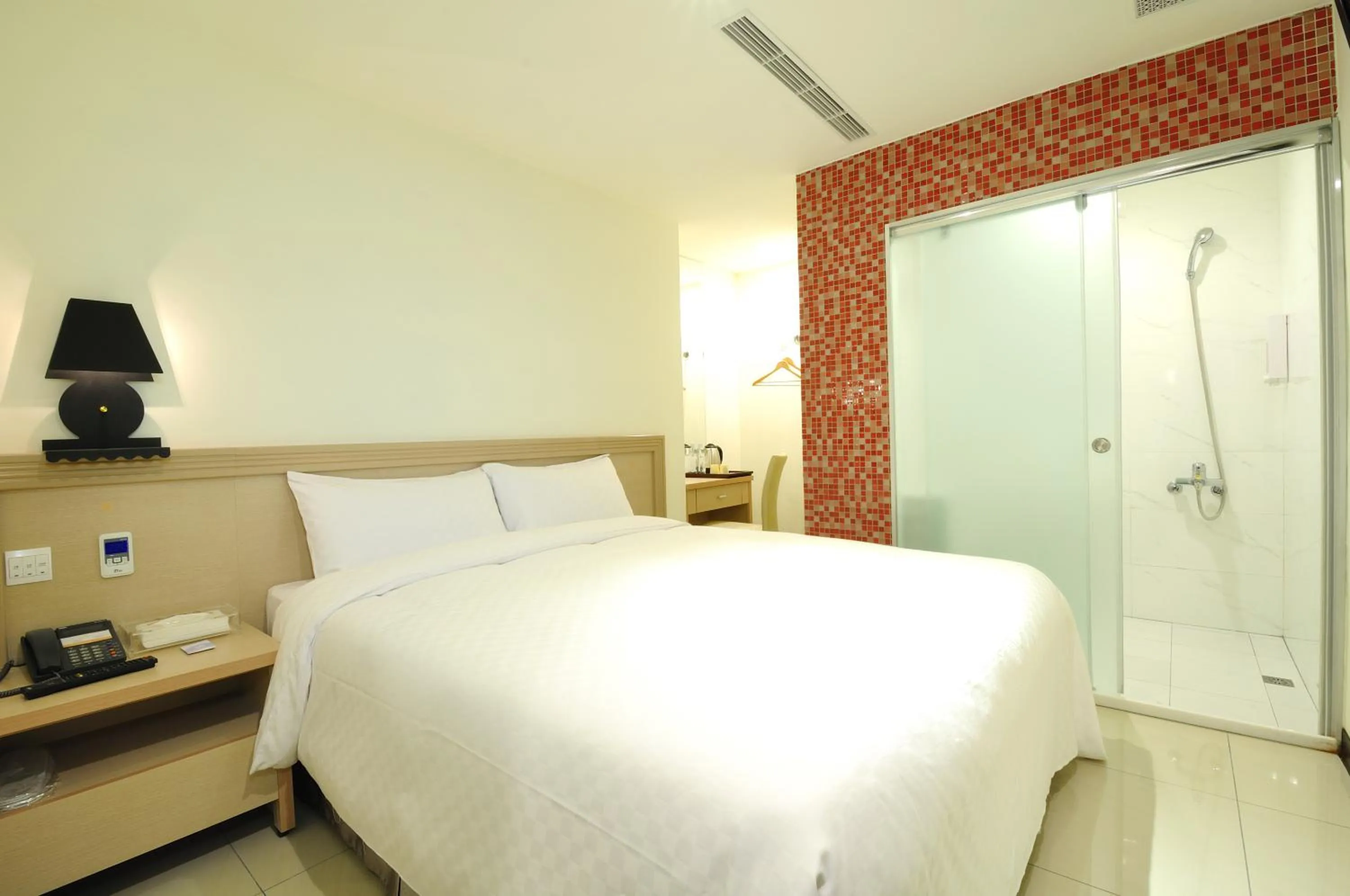 Bed in 安可旅店 Bravo Hotel