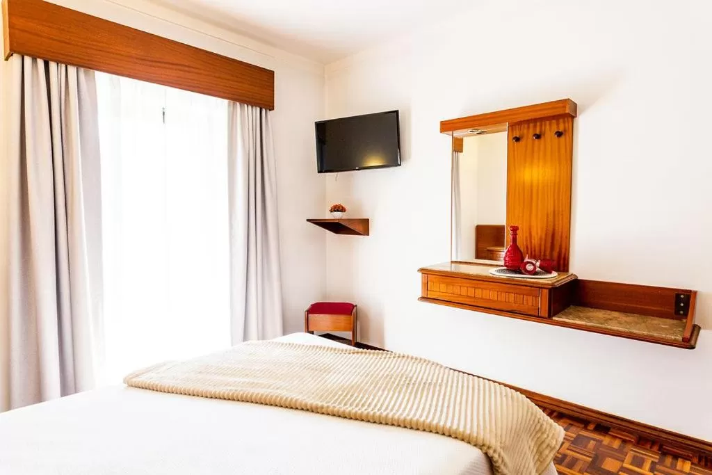 Bed in Dona Amélia Hotel by RIDAN Hotels