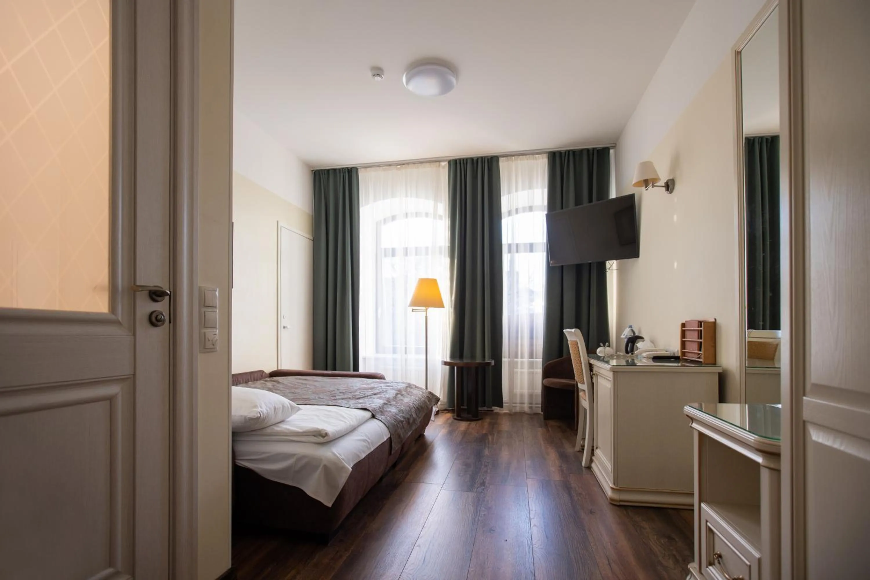 Seating area, Bed in Hotel St. Barbara