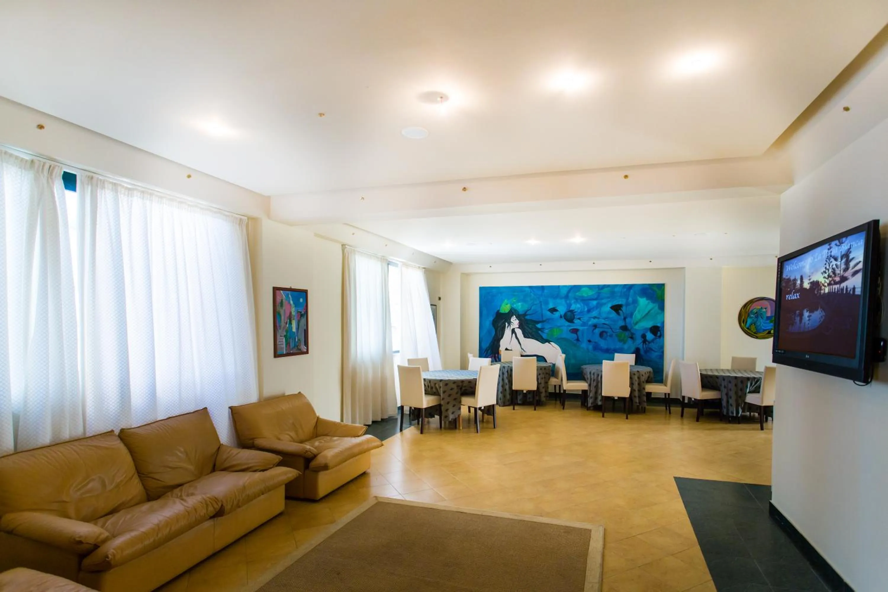 Communal lounge/ TV room in Hotel La Playa Blanca