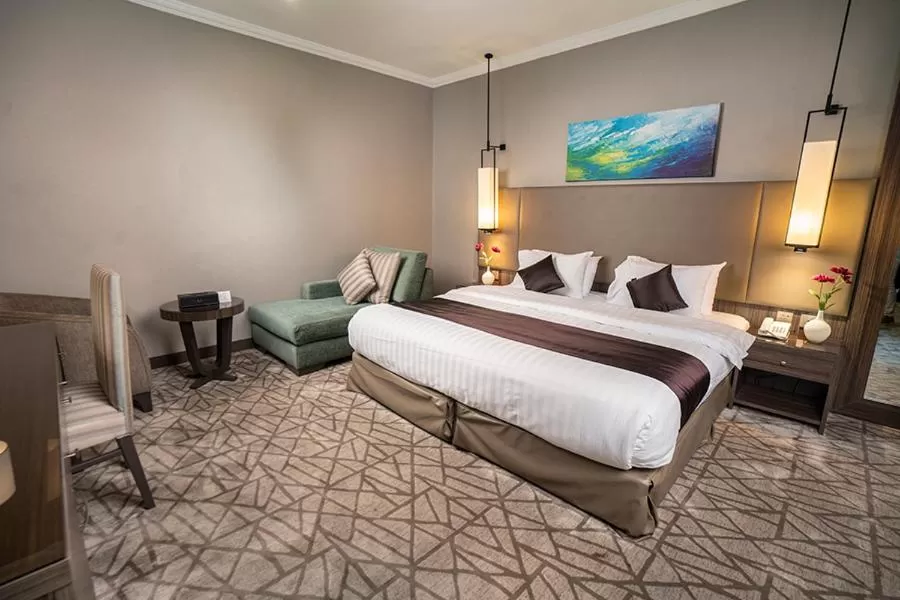 Bedroom in Aquila Al Hamra Hotel
