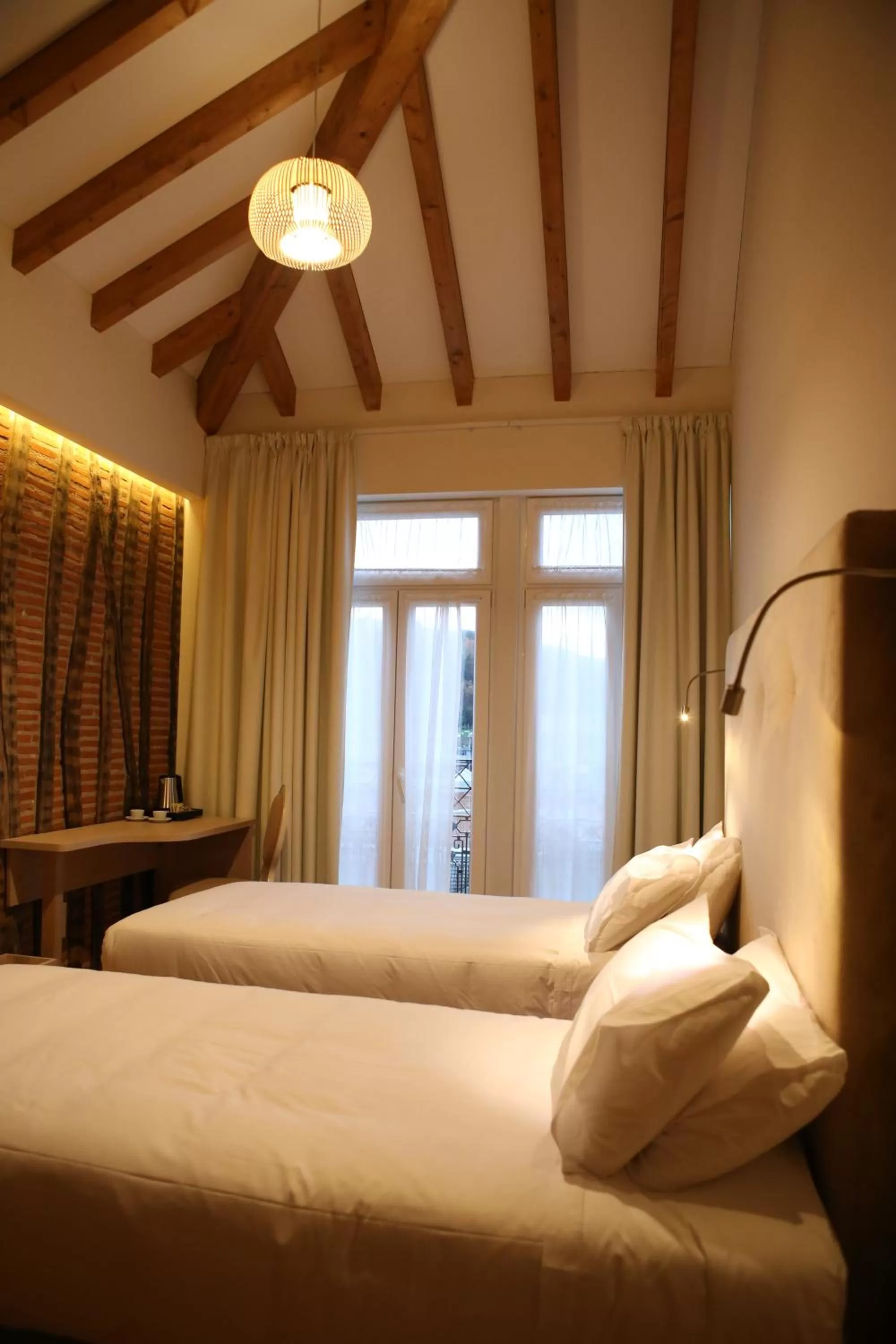 Bed in Muralha Charm House