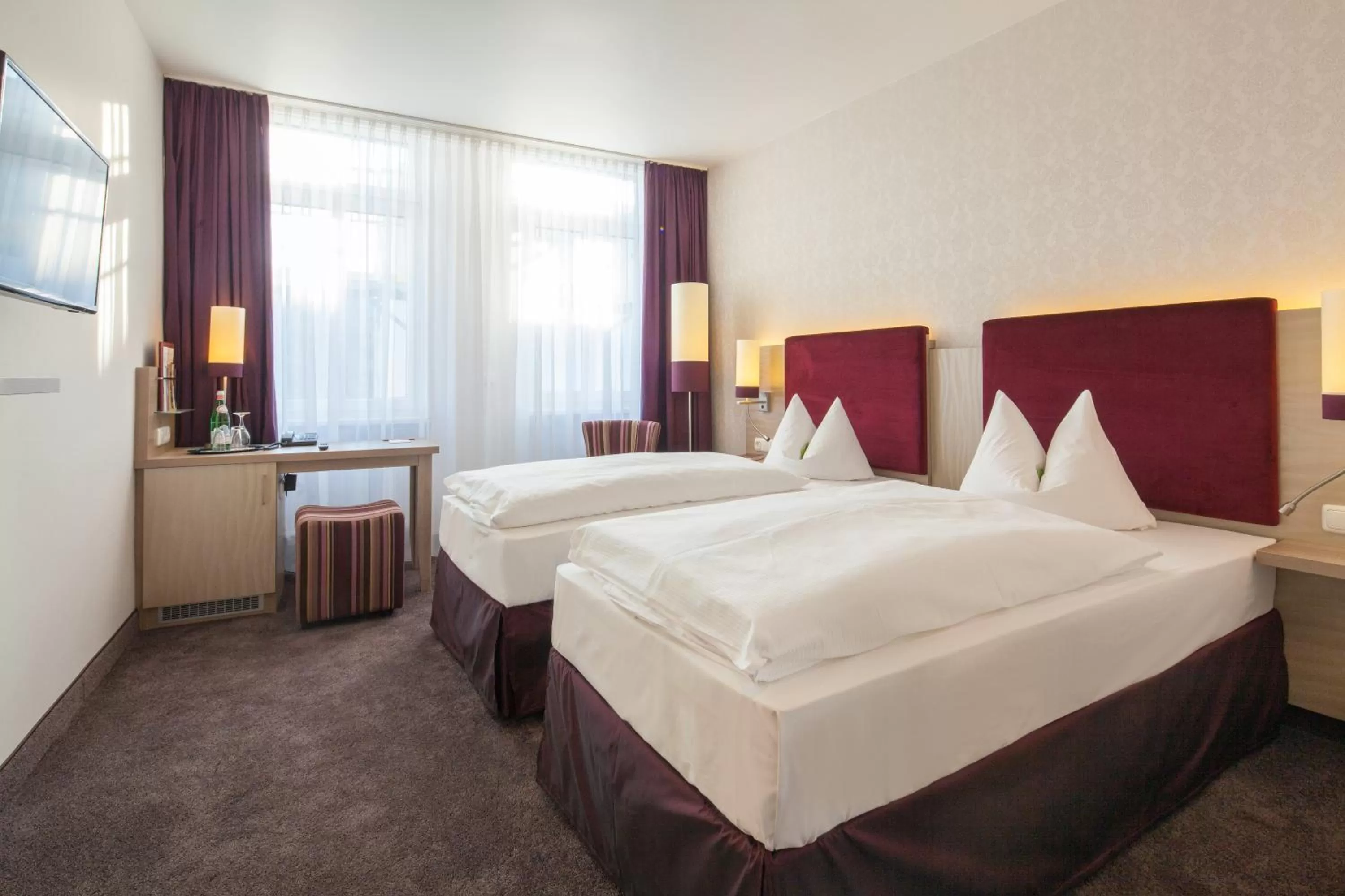 Bed in DORMERO Hotel Coburg