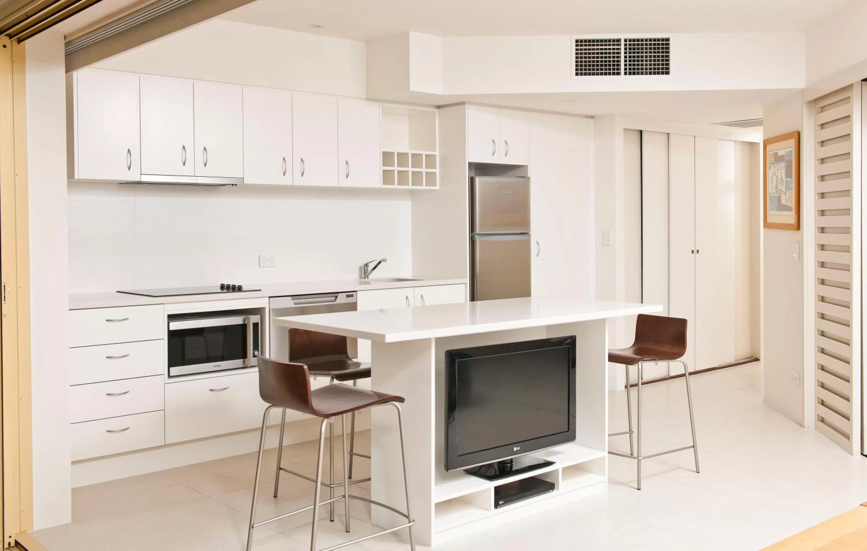 Kitchen or kitchenette in Mantra French Quarter Noosa