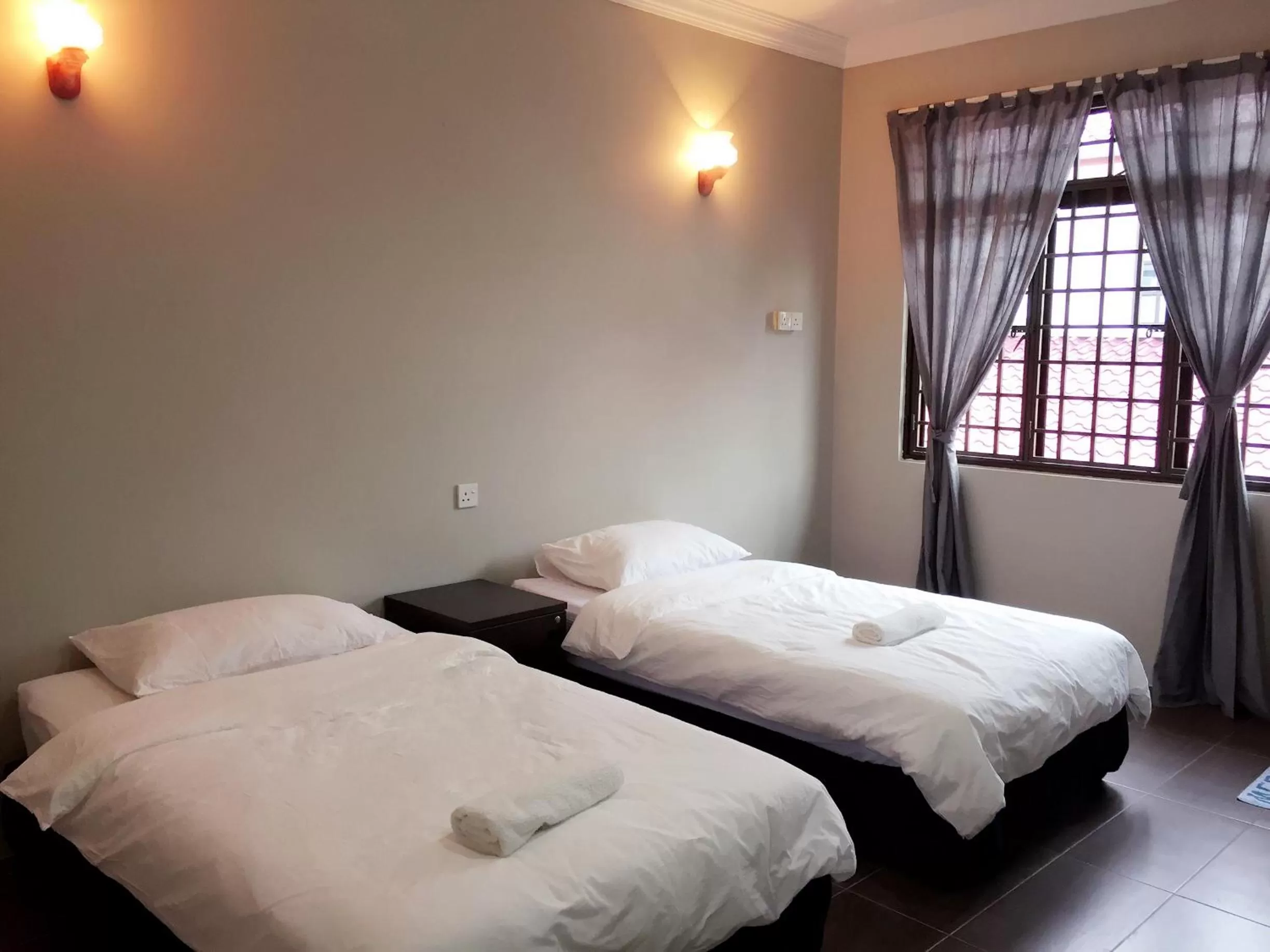 Photo of the whole room, Bed in Homestay Muar