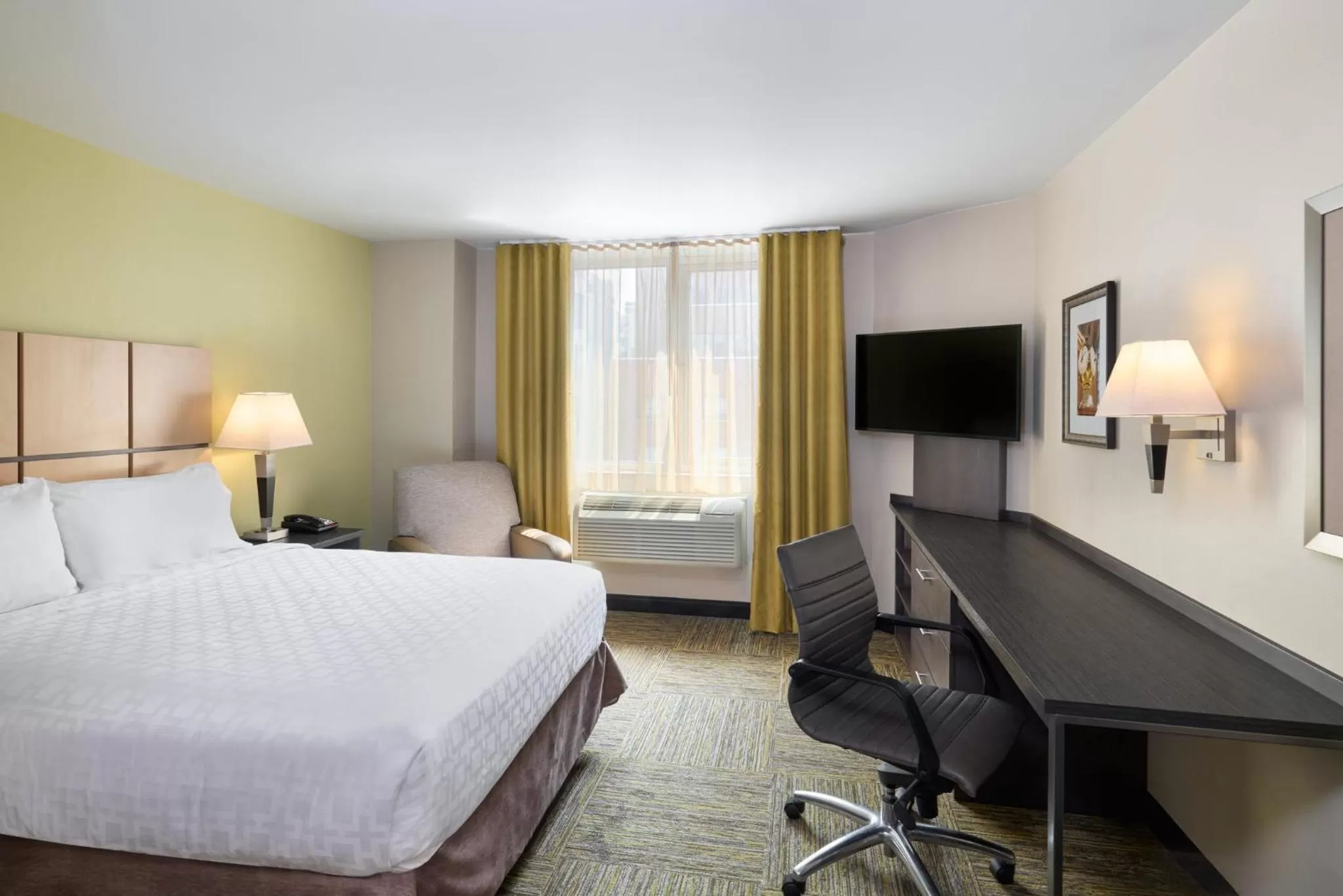 Photo of the whole room, Bed in Candlewood Suites NYC -Times Square by IHG