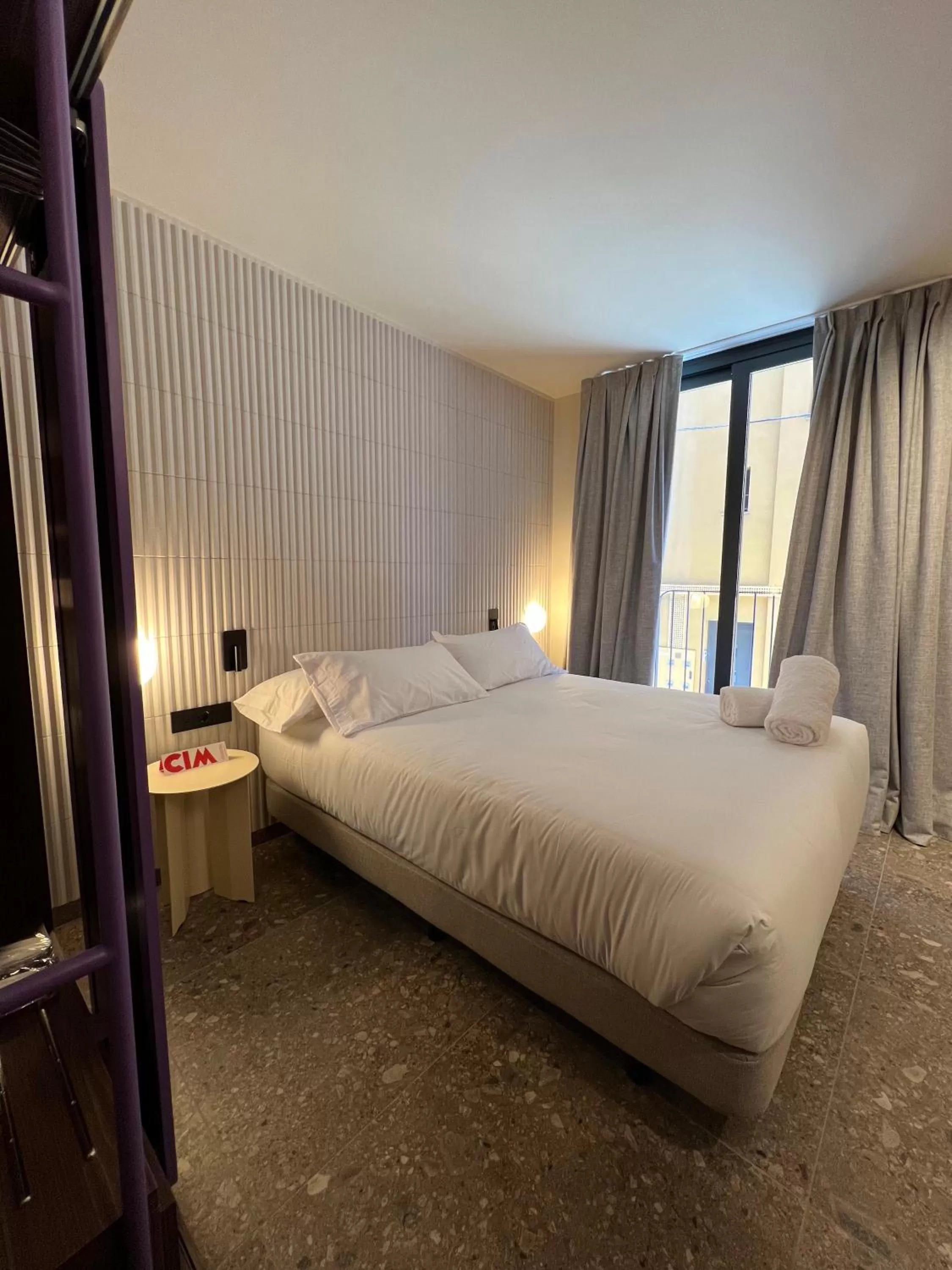 Bed in CIM HOTEL BOUTIQUE