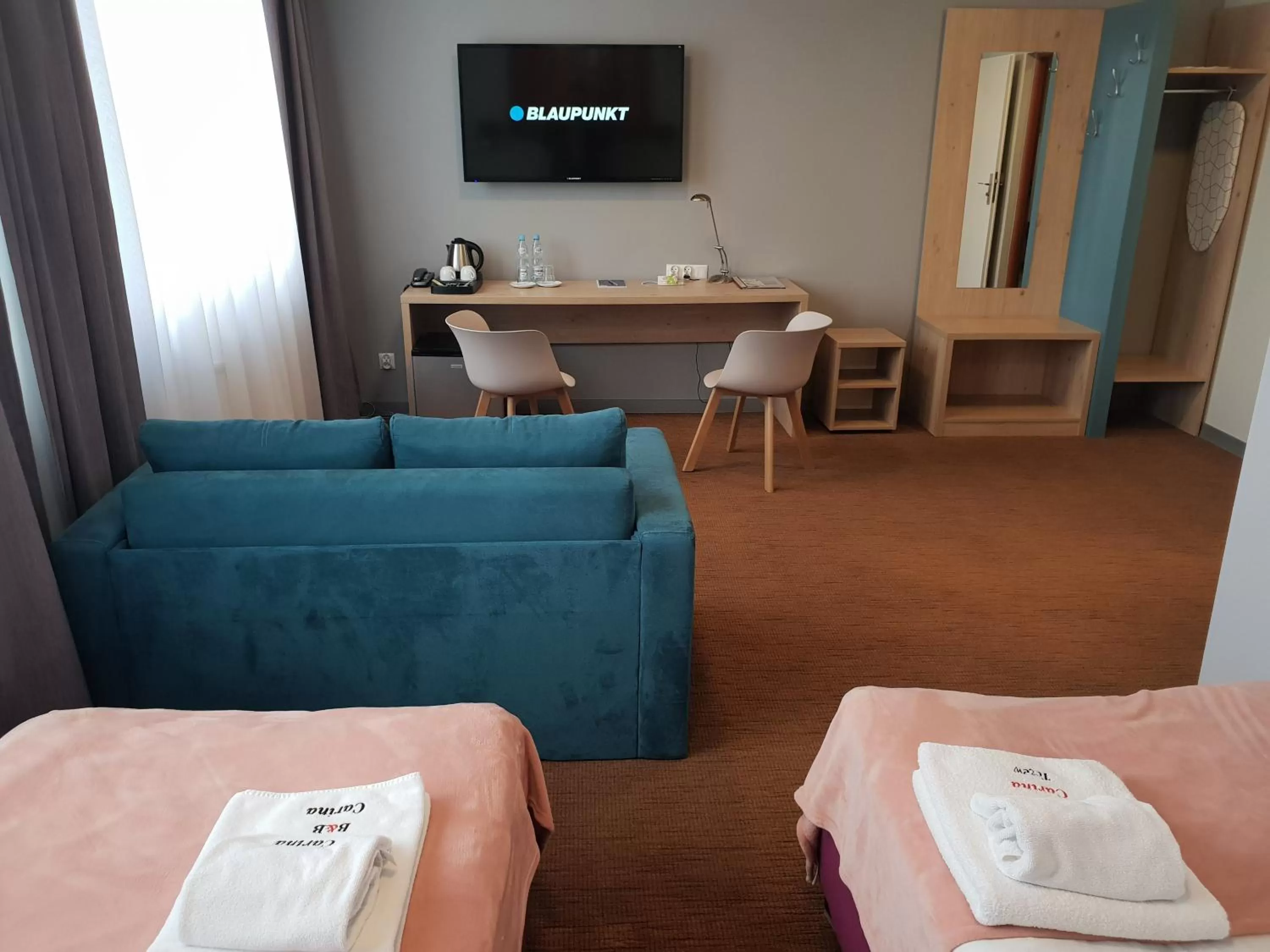 Photo of the whole room, Bed in Carina Hotel