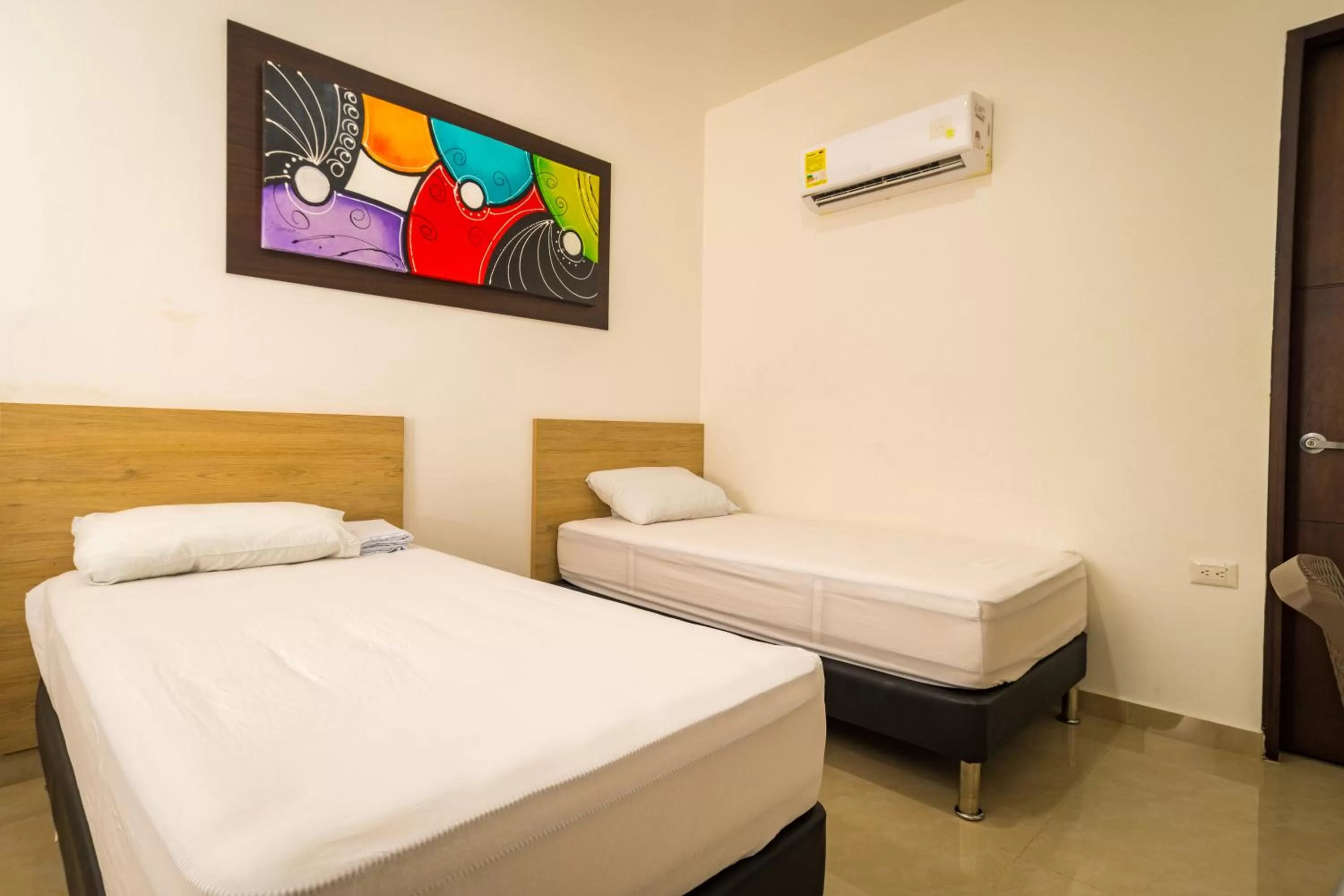 Bed in Genesis Hotel