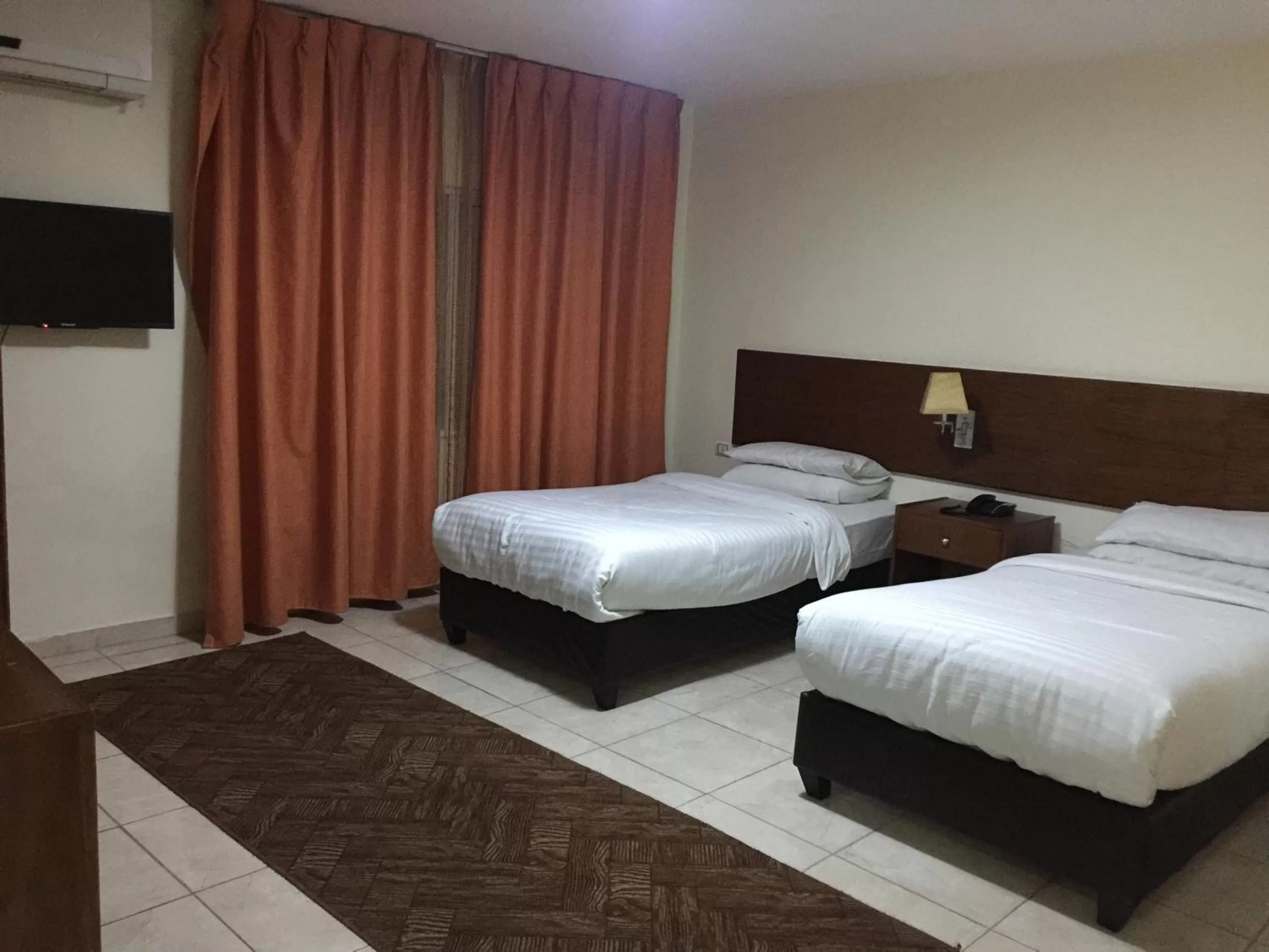 Bed in Zaina Plaza Hotel