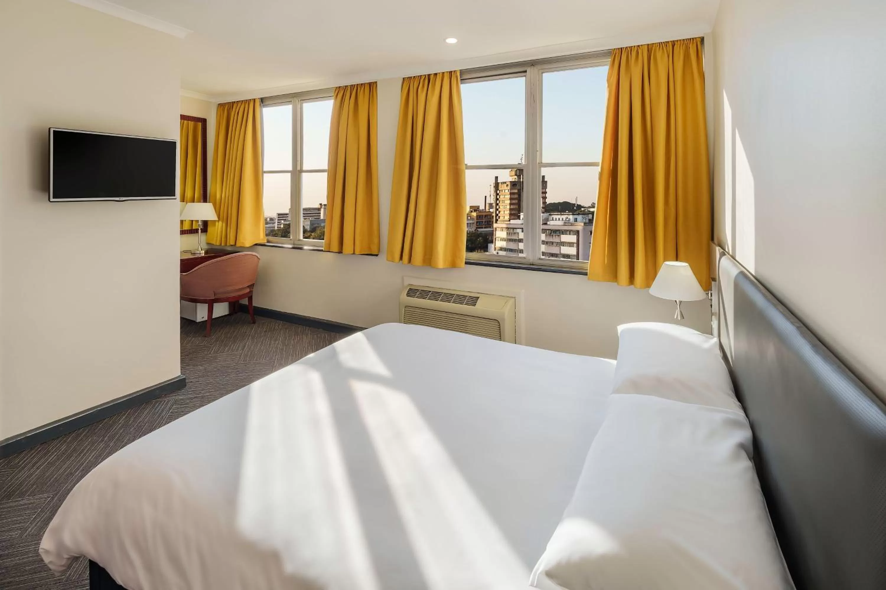 Photo of the whole room, Bed in Protea Hotel by Marriott Lusaka Cairo Road