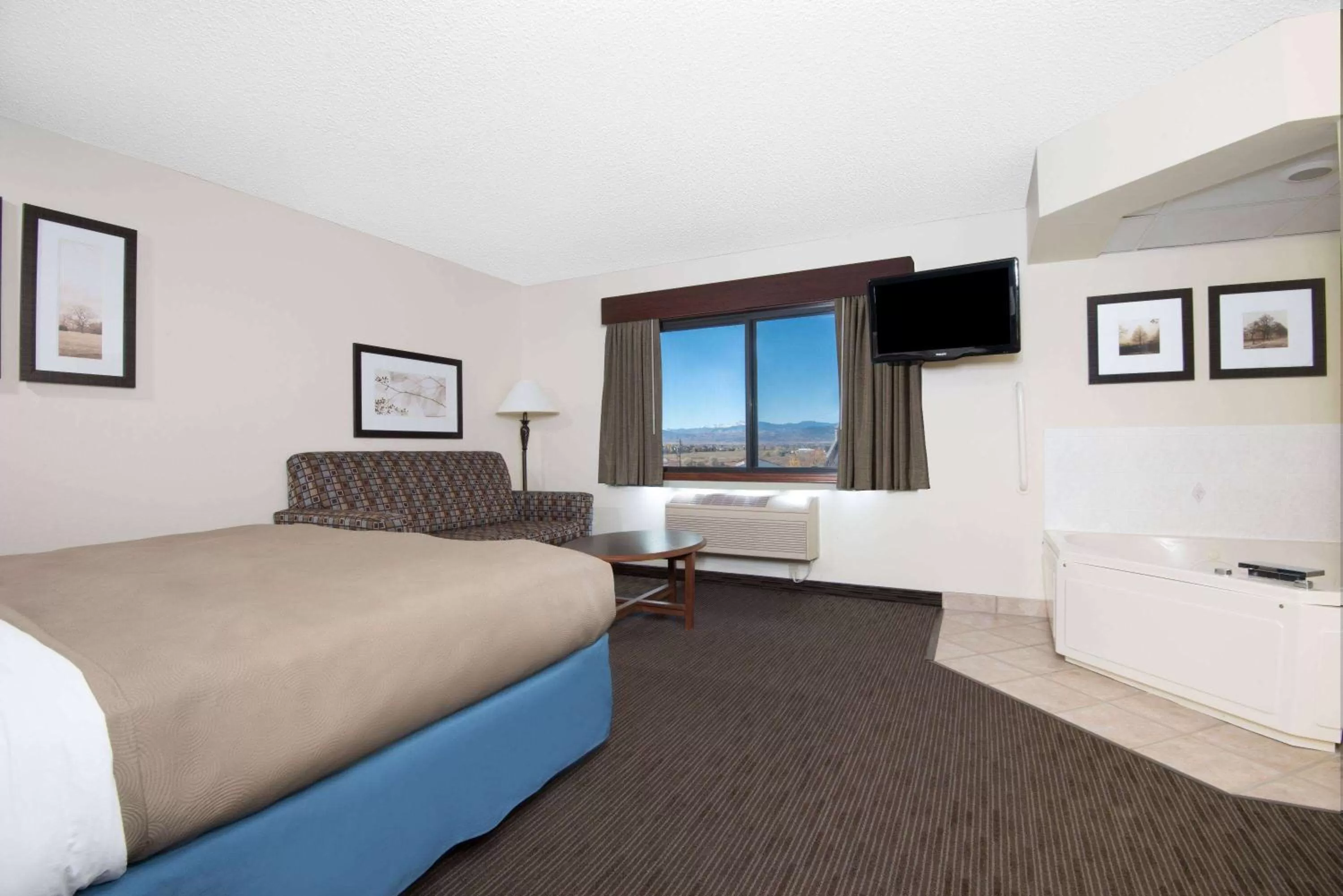 Bed in AmericInn by Wyndham Windsor Ft. Collins