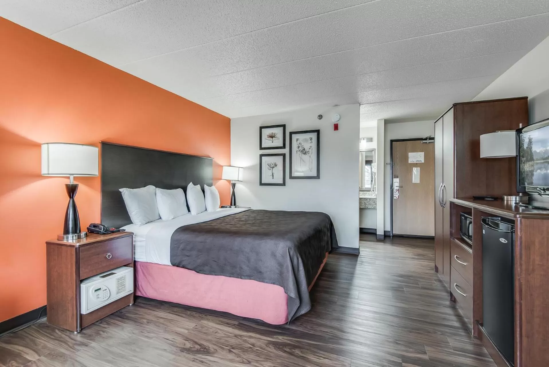 Bed in AmericInn by Wyndham Coon Rapids