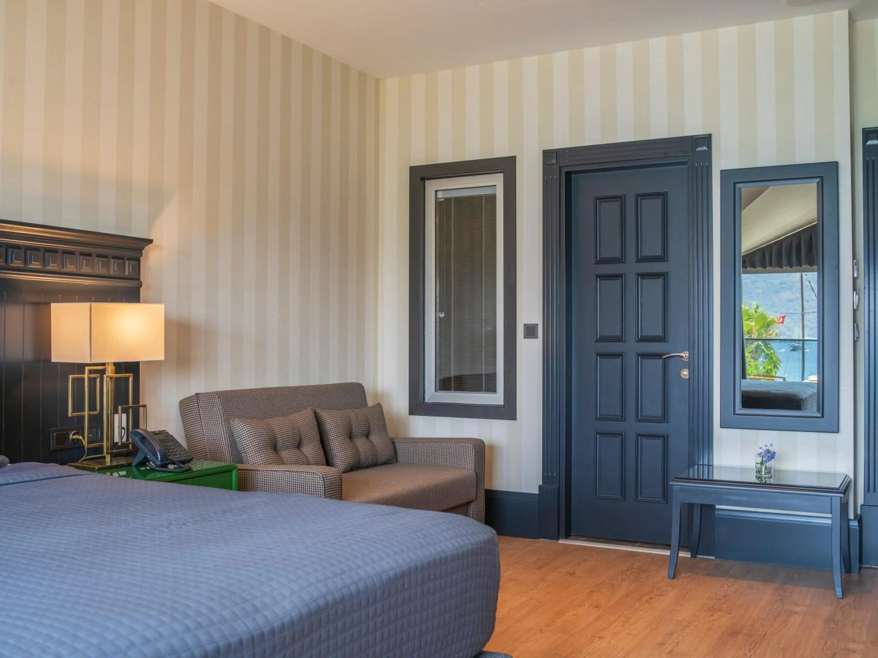 Seating area, Bed in Hotel Marina Bay Göcek