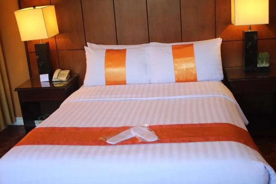 Bed in The Corporate Inn Hotel
