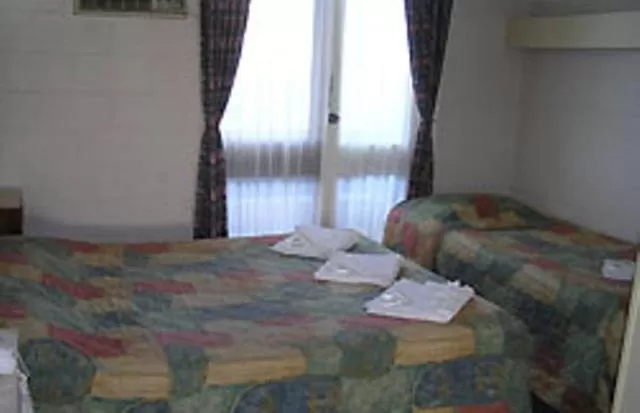 Bed in Pathfinder Motel