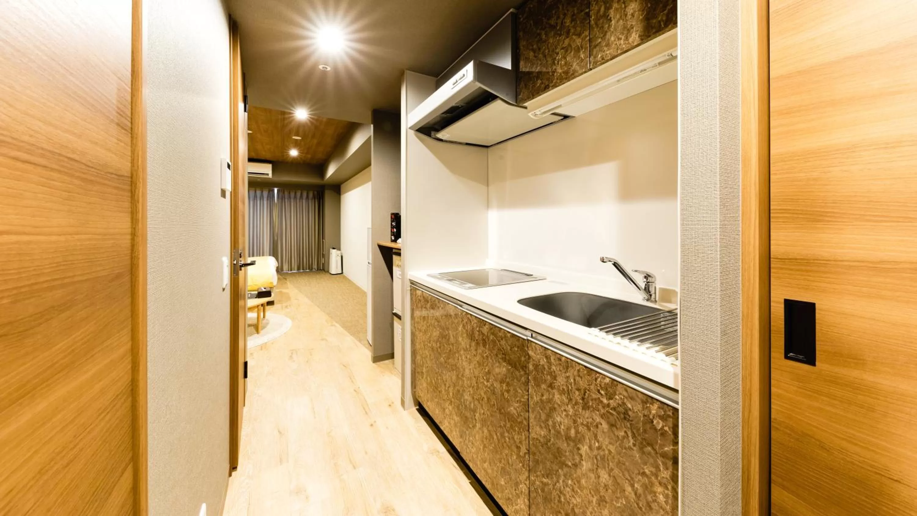 Kitchen or kitchenette in Takuto Hotel Osaka Shinsaibashi