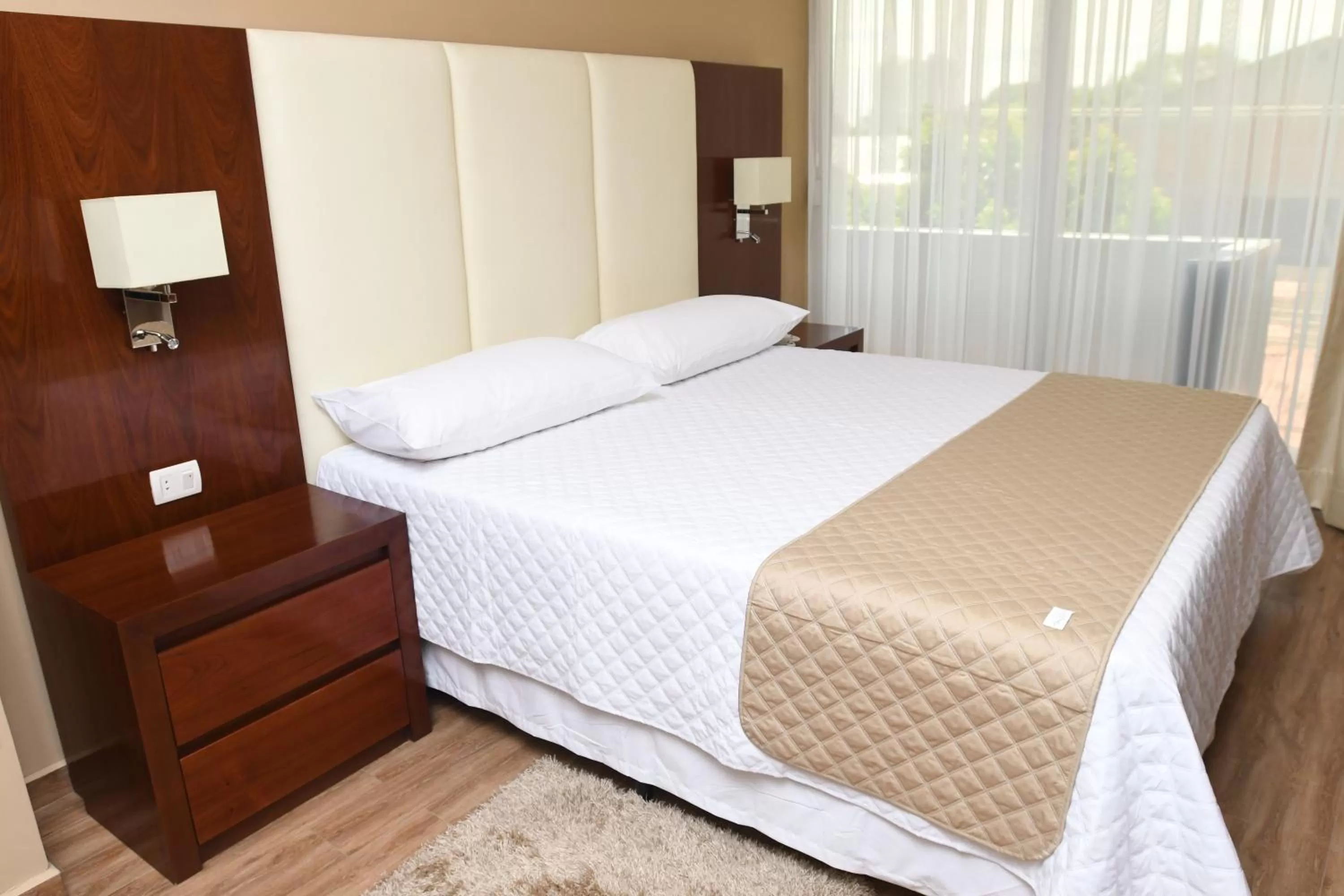 Bed in Taos Apart Hotel