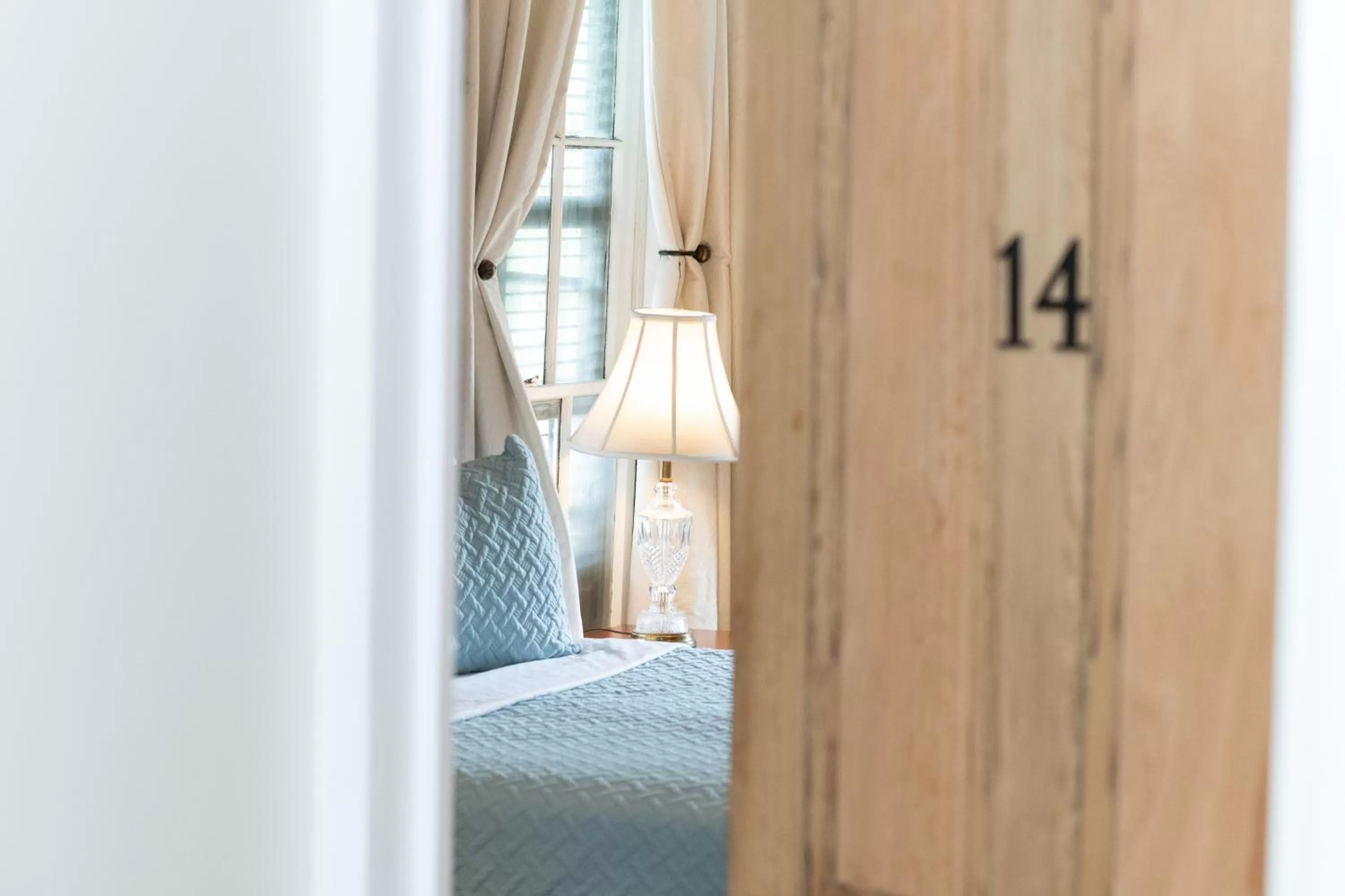 Bed in The Esplanade Guesthouse Mansion