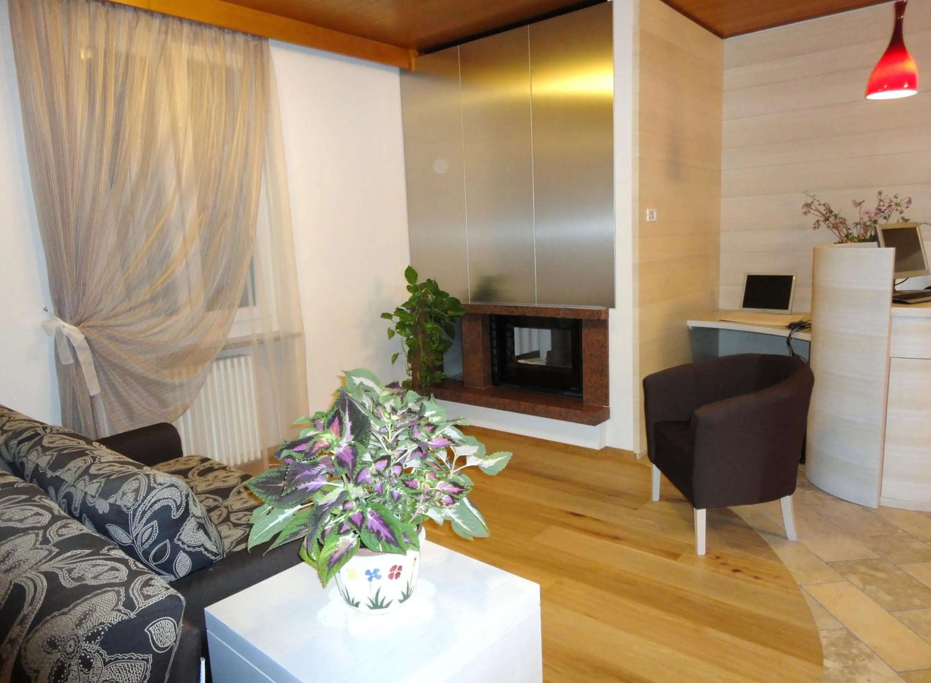 Communal lounge/ TV room in Albergo Tuenno