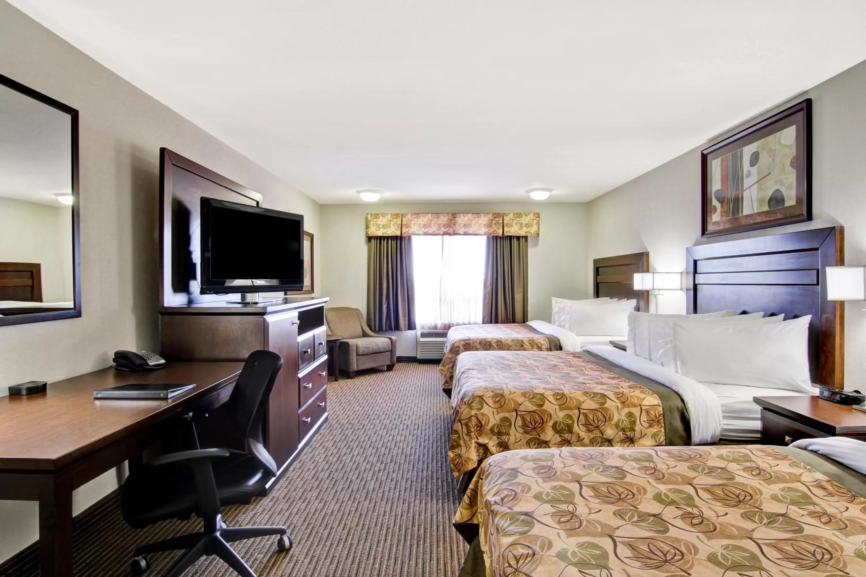 Standard Queen Room with Three Queen Beds in Coast Weyburn Hotel